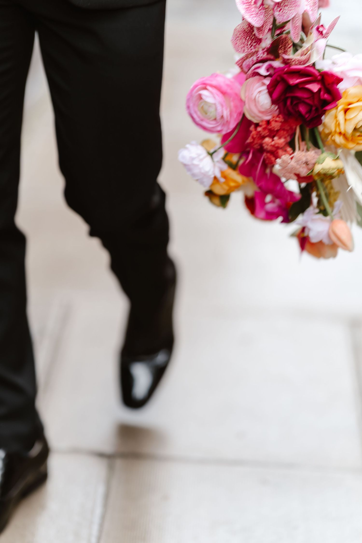 Relaxed wedding couple at The Hoxton, Holborn. London Wedding Photographer.  vibrant bouquet flowers