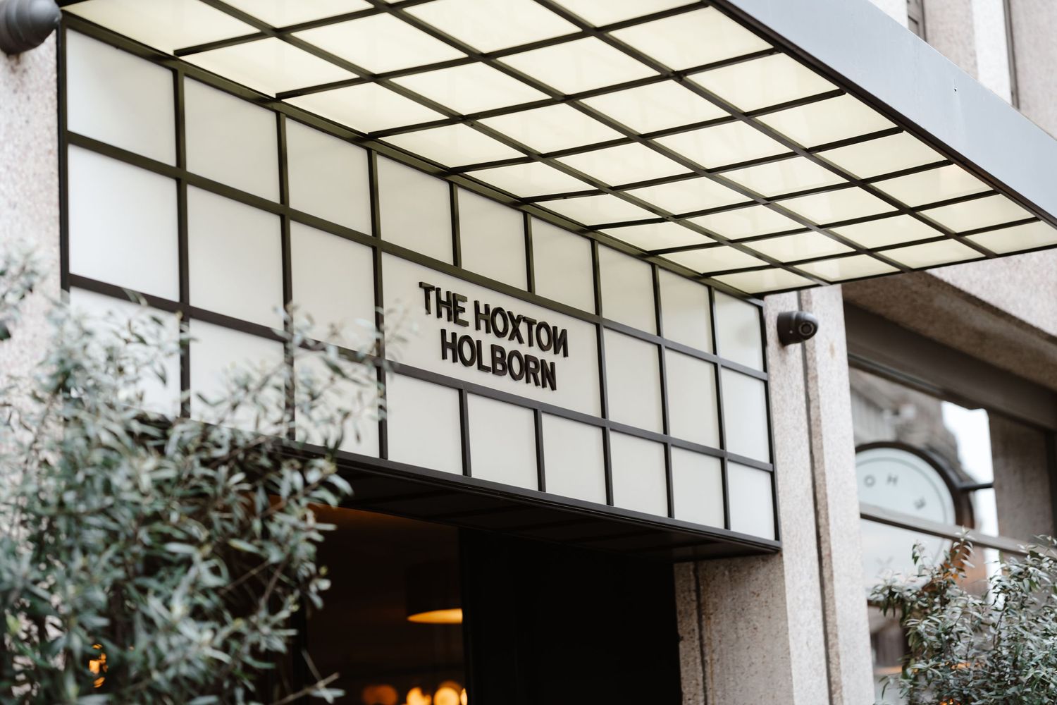 Relaxed wedding couple at The Hoxton, Holborn. London Wedding Photographer.