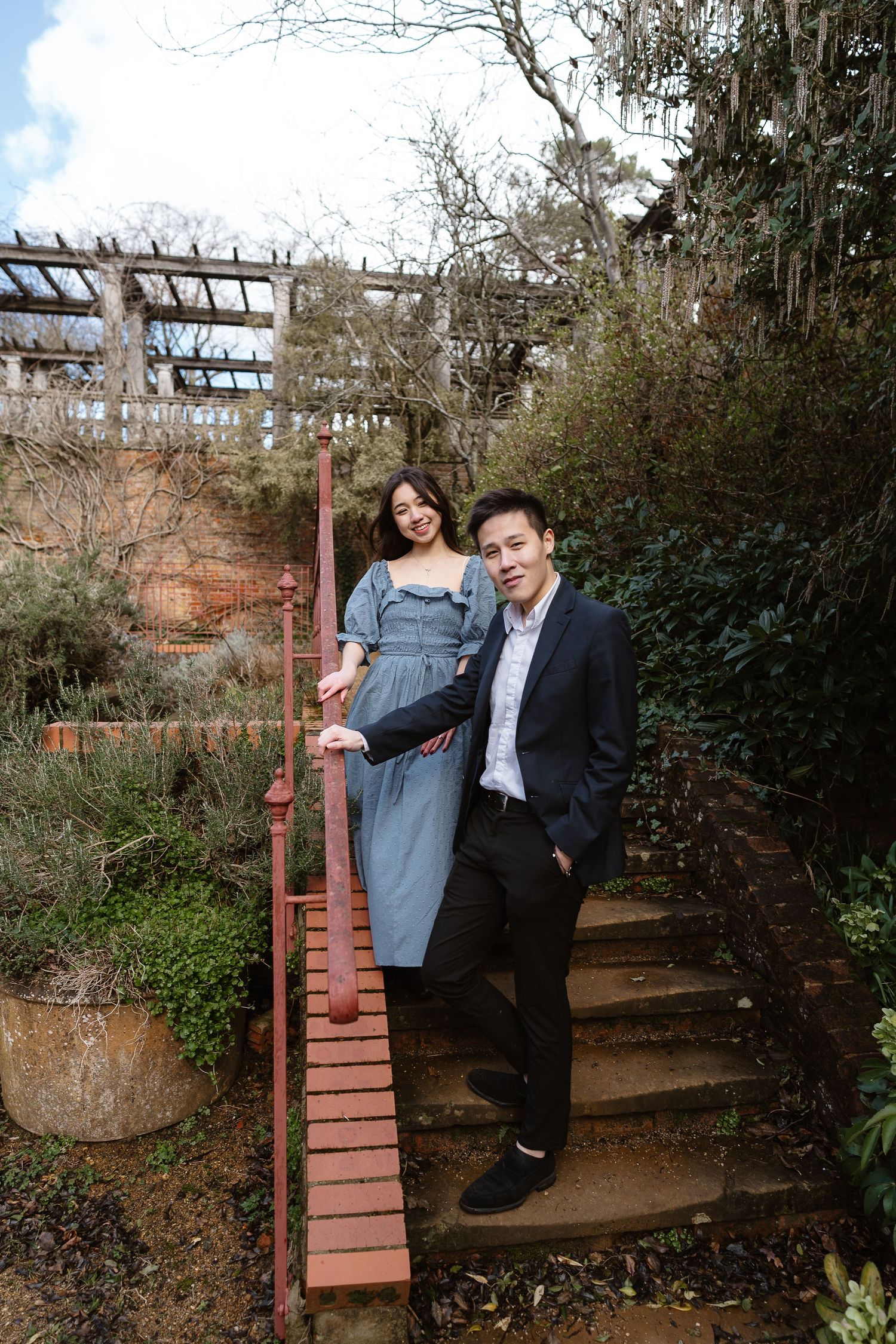 Laidback couple, casual blue flowing dress, casual trousers and jacket, London photographer