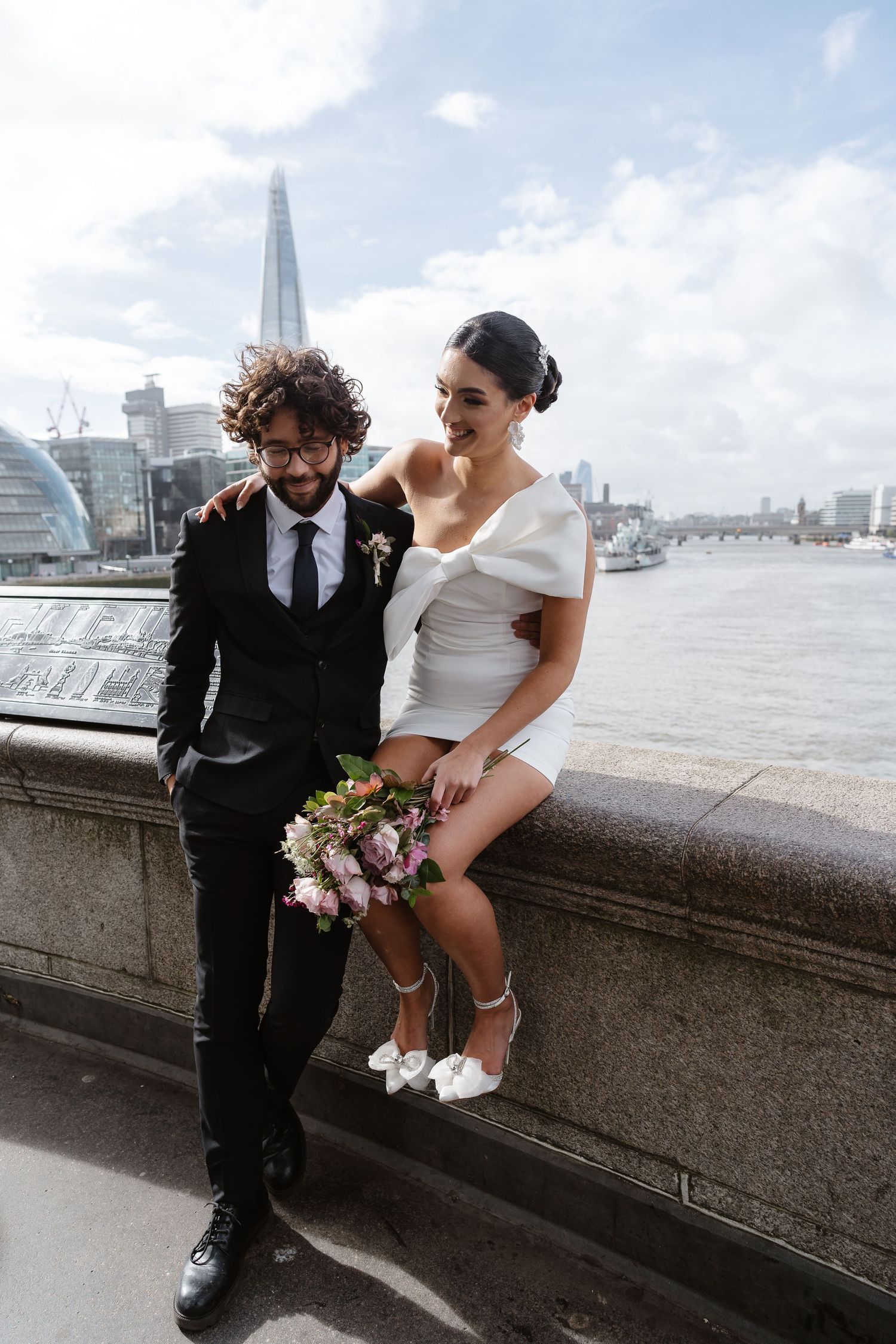 Luxury wedding photos at Tower Bridge. Bride short dress. the shard. Editorial. London Wedding Photographer. romantic