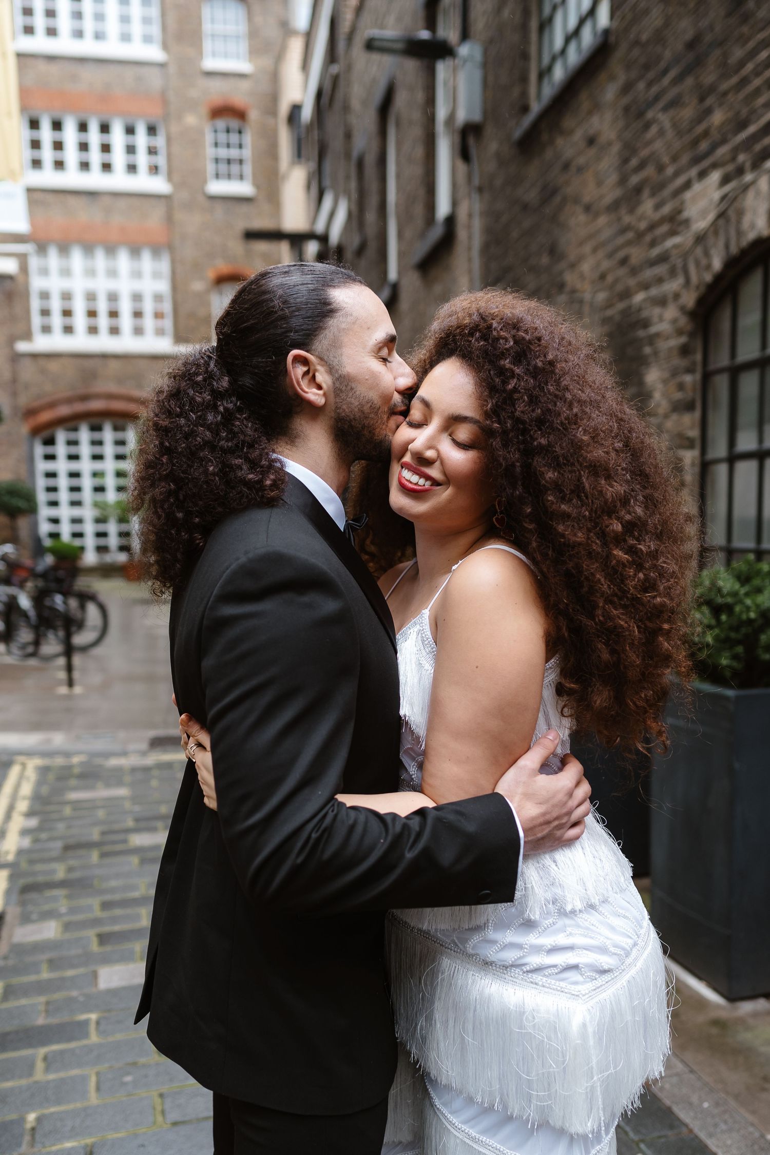 Relaxed wedding couple at The Hoxton, Holborn. London Wedding Photographer.  vibrant bouquet flowers