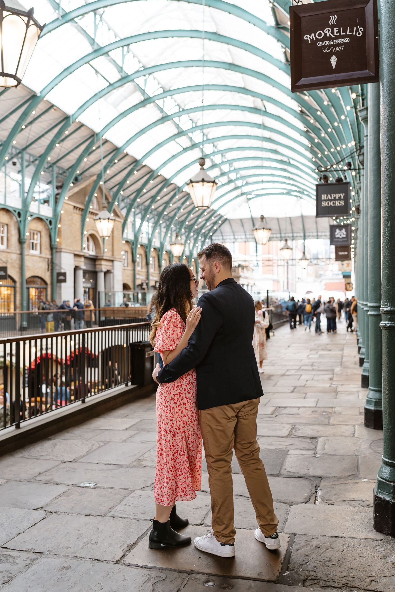 Alitha & James in Londons iconic covent garden in Spring for their exciting Engagement / Pre-Wedding photoshoot engagement ring