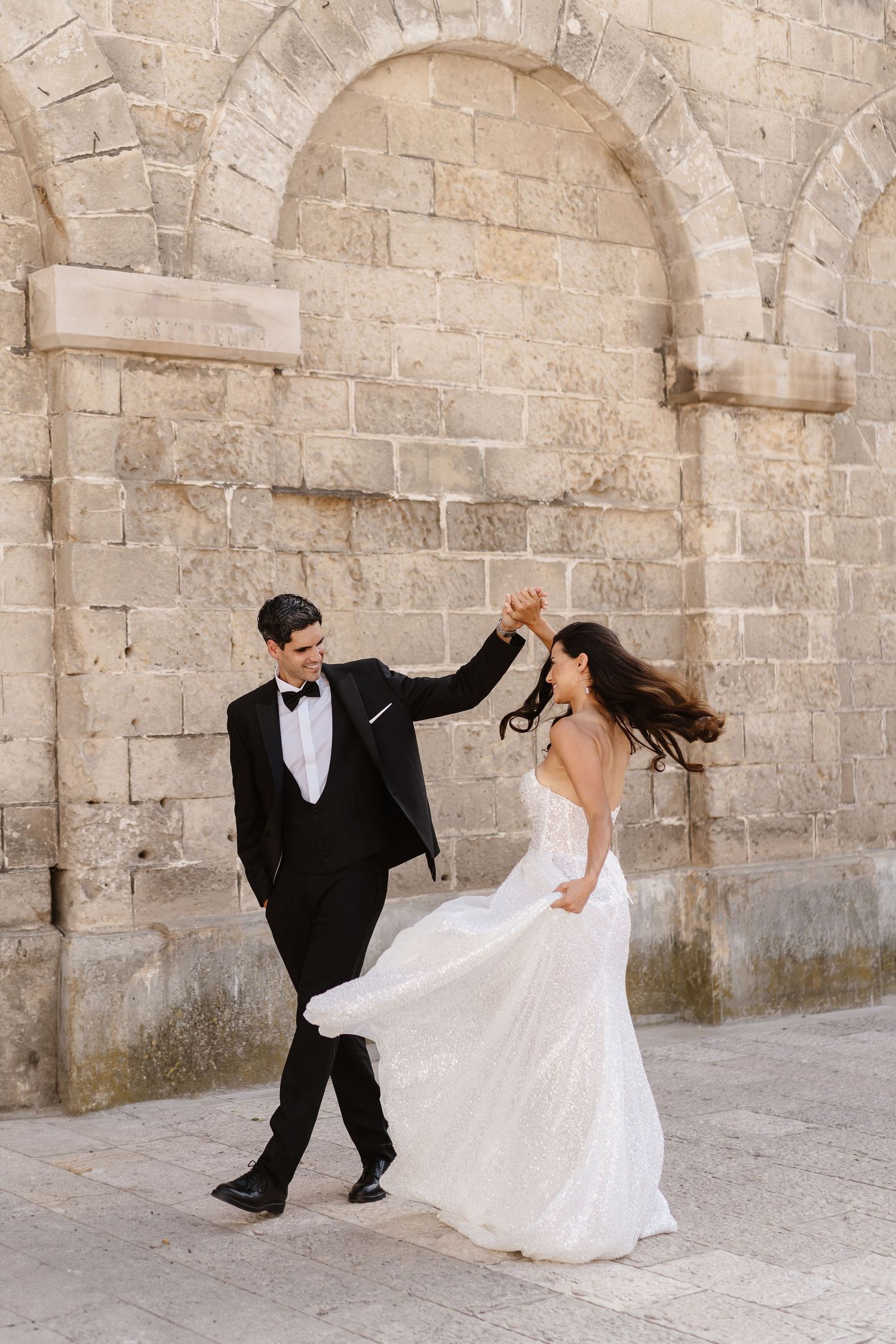 Relaxed and playful through the streets. Destination wedding photographer