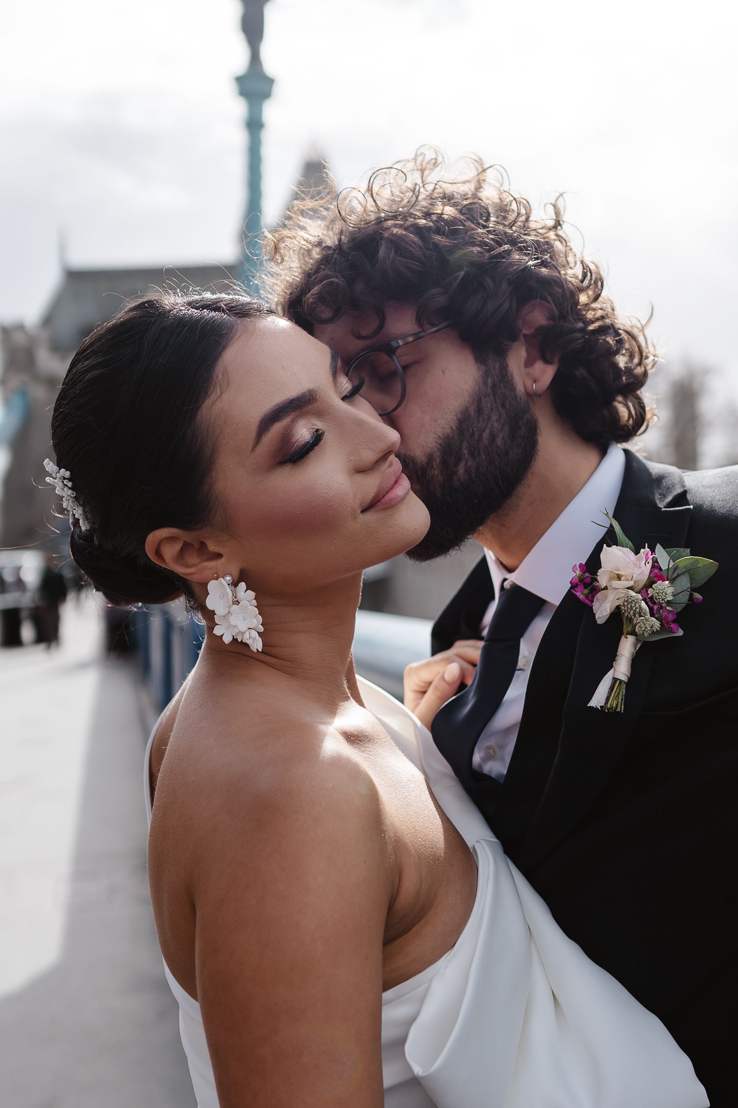 Luxury wedding photos at Tower Bridge. Bride short dress. Fun photos. Editorial. London Wedding Photographer. romantic