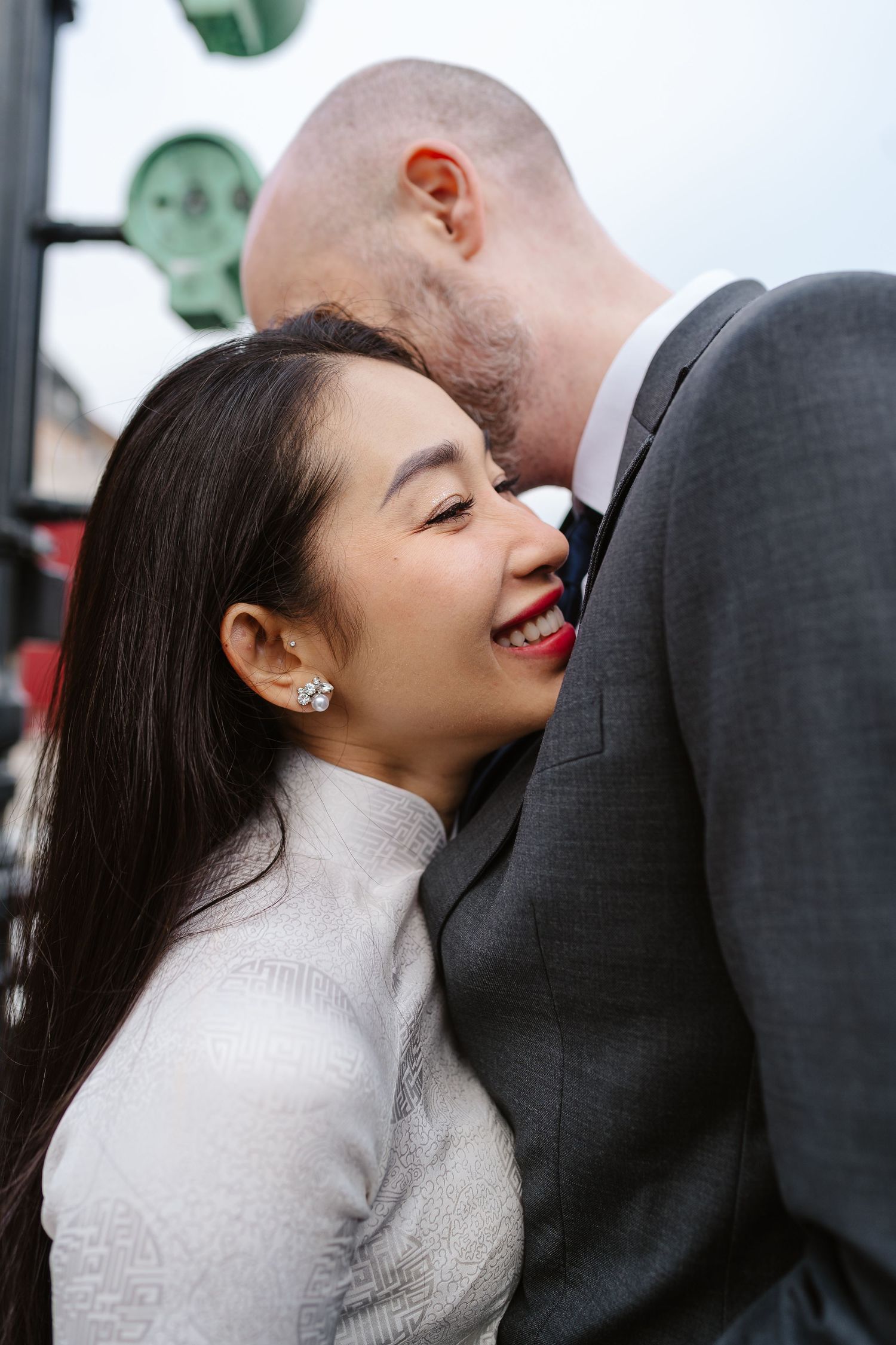 Newlyweds love along Nyhavn Canal in Copenhagen. Denmark wedding. Scandinavian & Destination Wedding Photographer