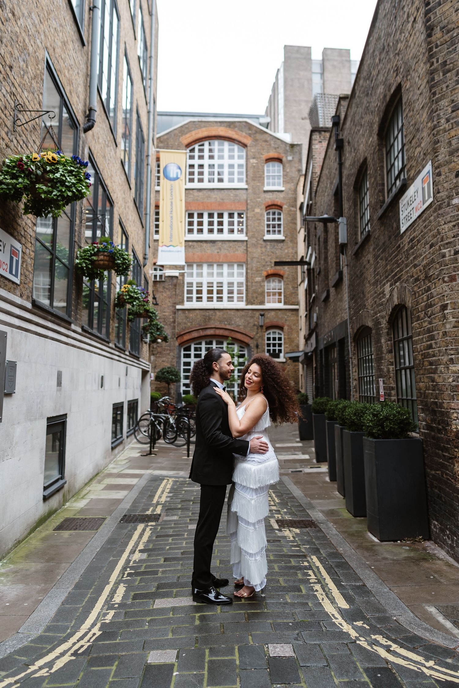 Relaxed wedding couple at The Hoxton, Holborn. London Wedding Photographer.  vibrant bouquet flowers