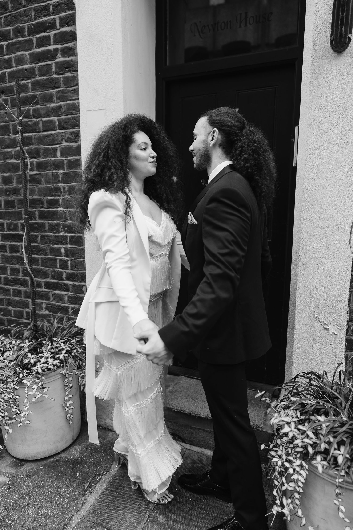 Relaxed wedding couple at The Hoxton, Holborn. London Wedding Photographer.  vibrant bouquet flowers