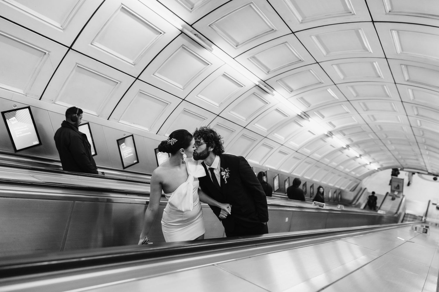 bride and groom in the London Underground Tube, direct flash editorial photography. Modern fun wedding photos. London