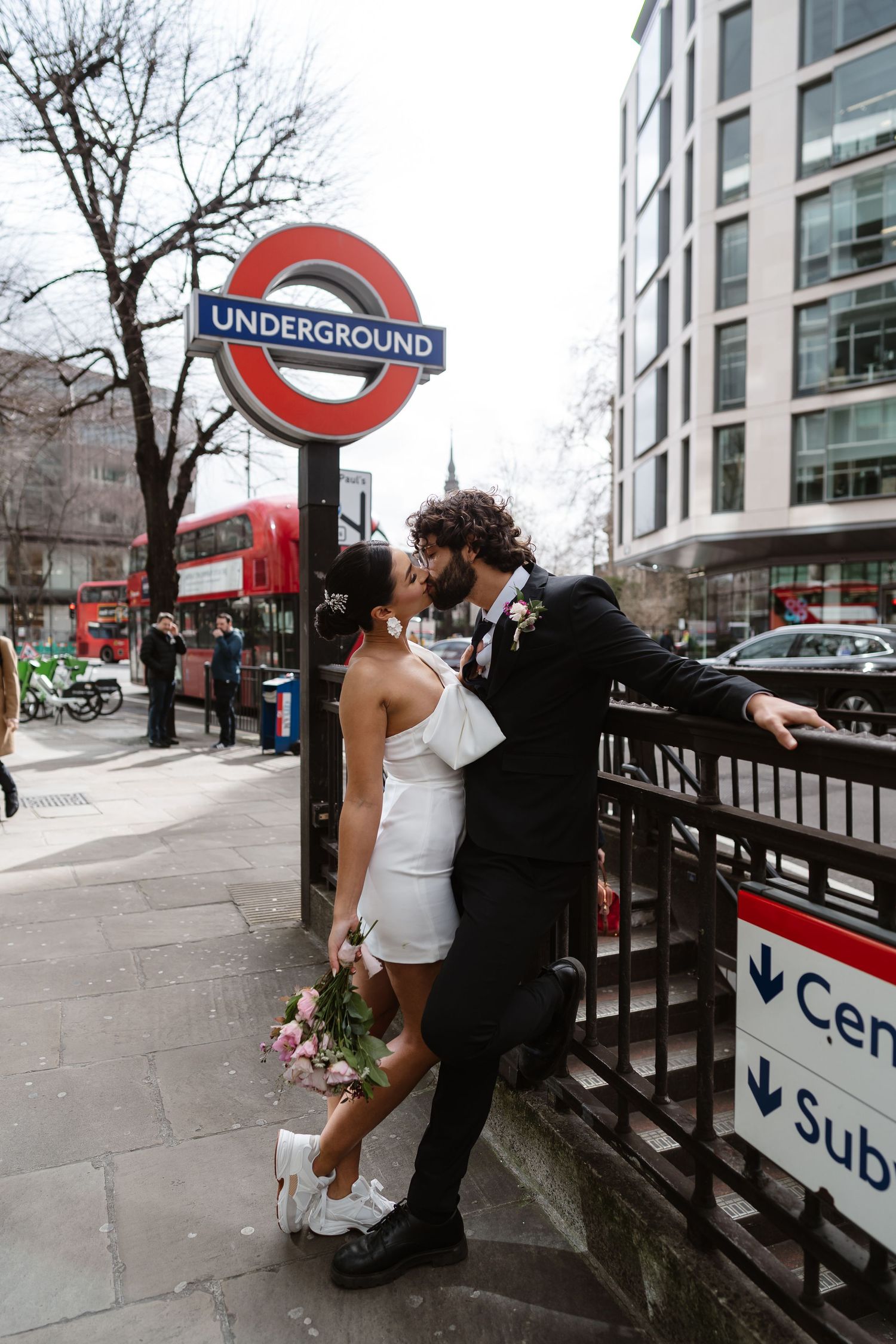 Bride and groom on London Underground tube wedding photos. Taken by London Wedding Photographer