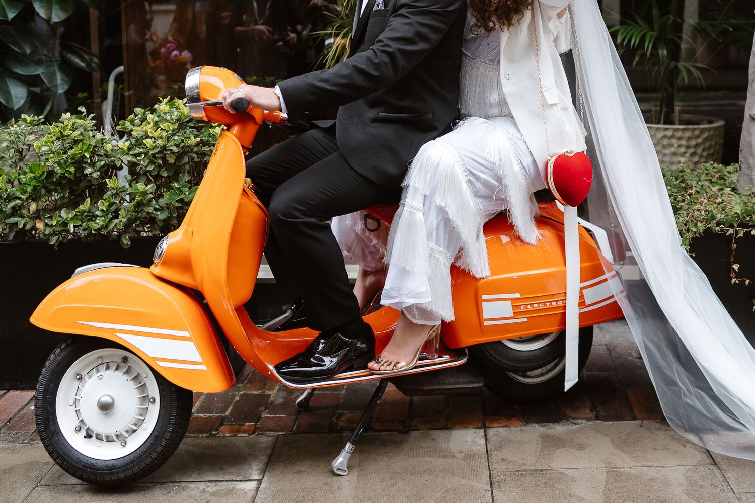 Relaxed wedding couple at The Hoxton, Holborn. London Wedding Photographer. Vespa