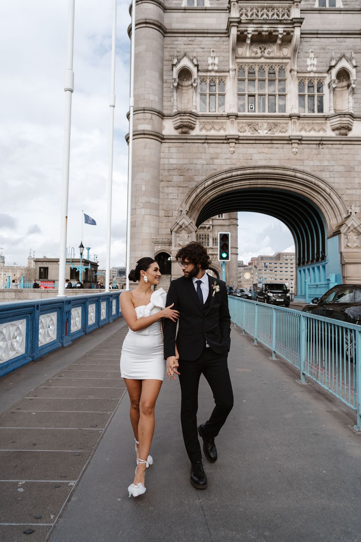 Luxury wedding photos at Tower Bridge. Bride short dress. documentary. Editorial. London Wedding Photographer. romantic