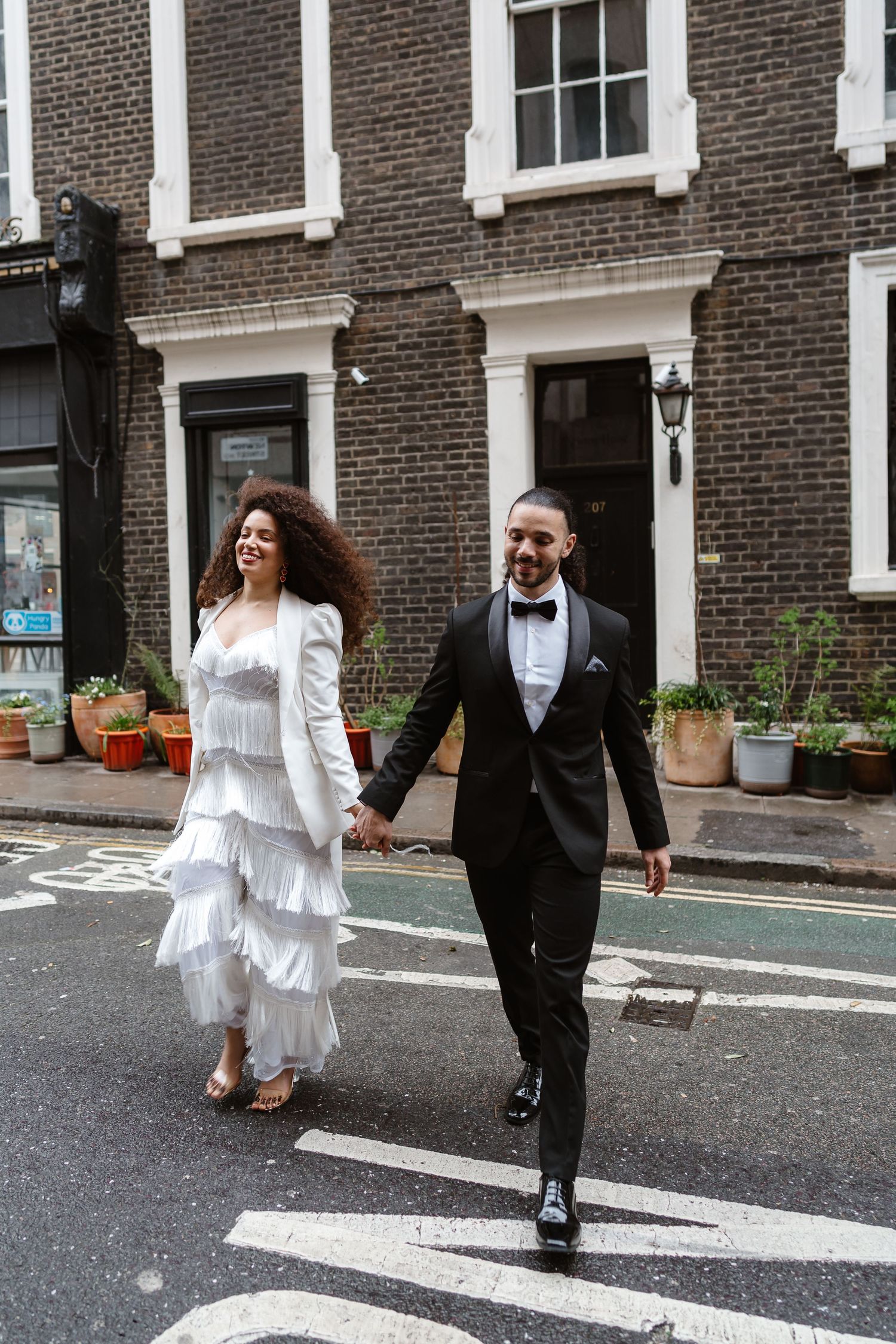 Relaxed wedding couple at The Hoxton, Holborn. London Wedding Photographer.  vibrant bouquet flowers