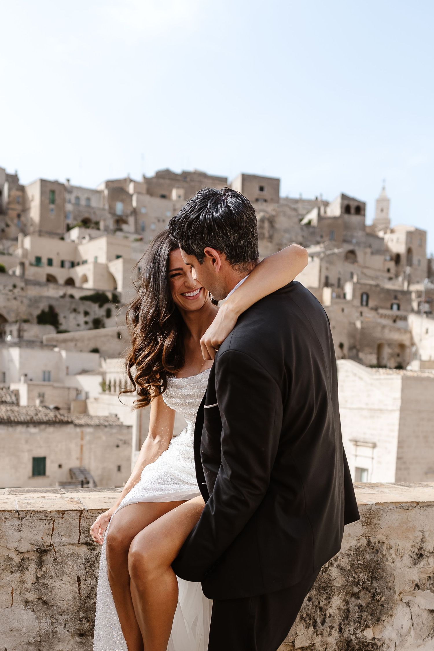 Fun and flirty sitting on the old wall, warm exchanges
