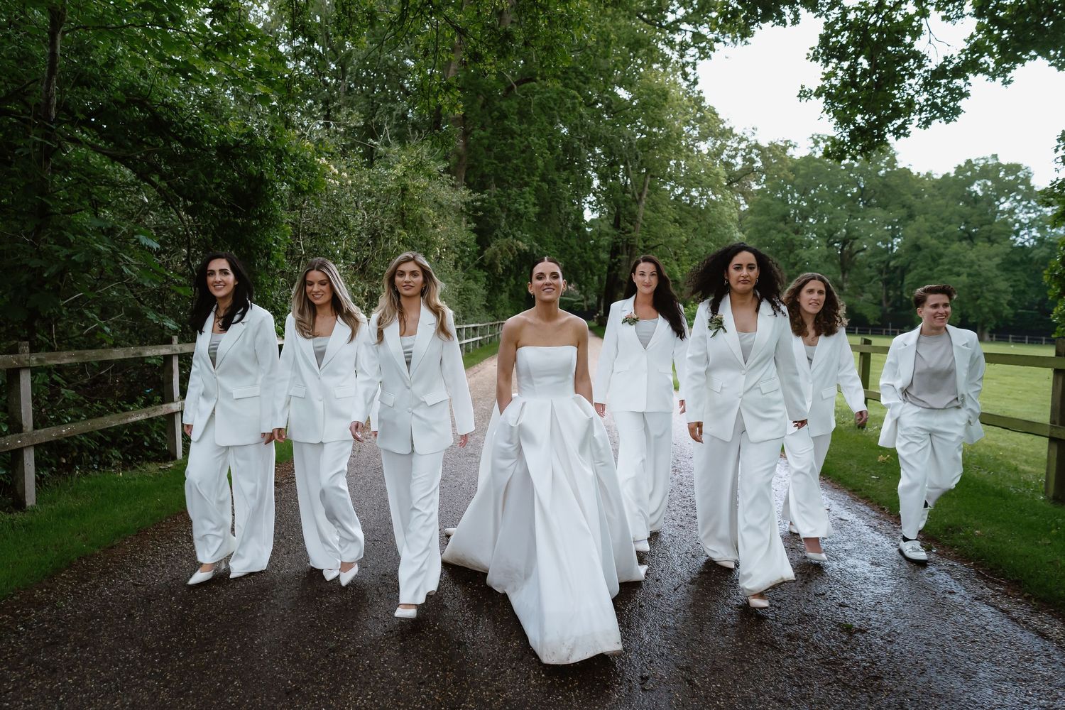 Vogue-esque - Modern - Sophisticated -  Making a statement - Bridesmaids in White Suits compliment Vera Wang dress.