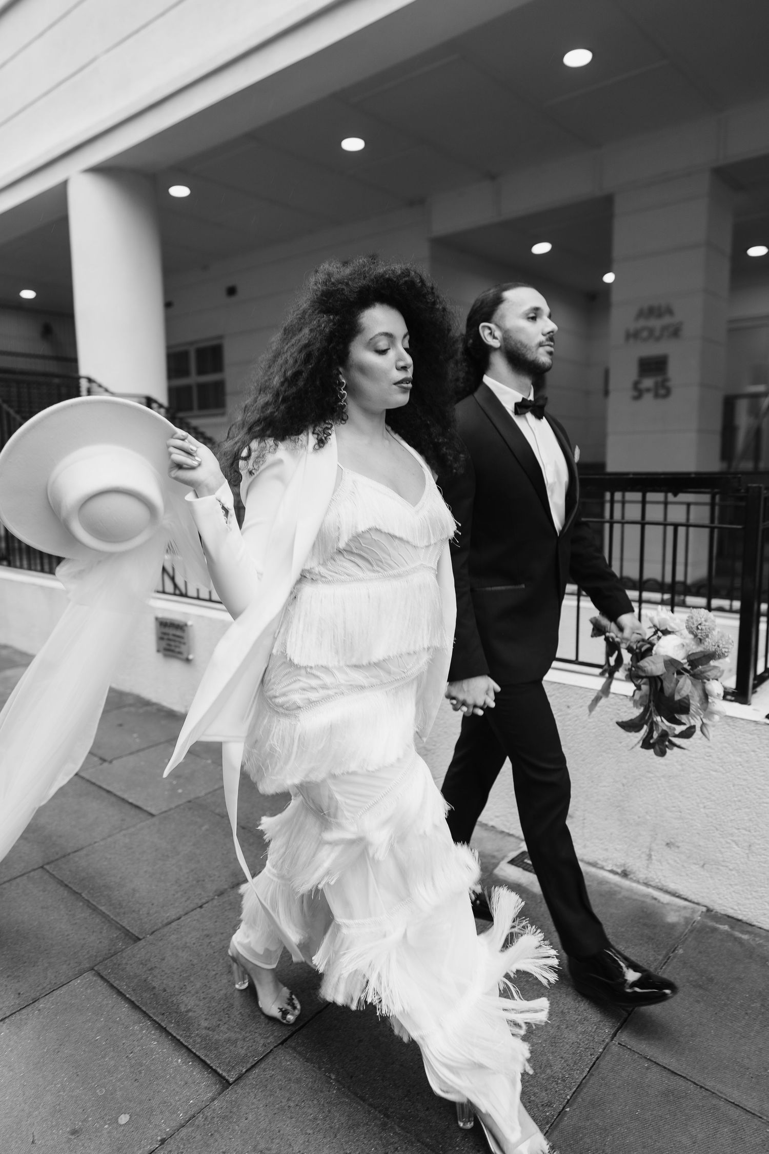 Relaxed wedding couple at The Hoxton, Holborn. London Wedding Photographer.  vibrant bouquet flowers