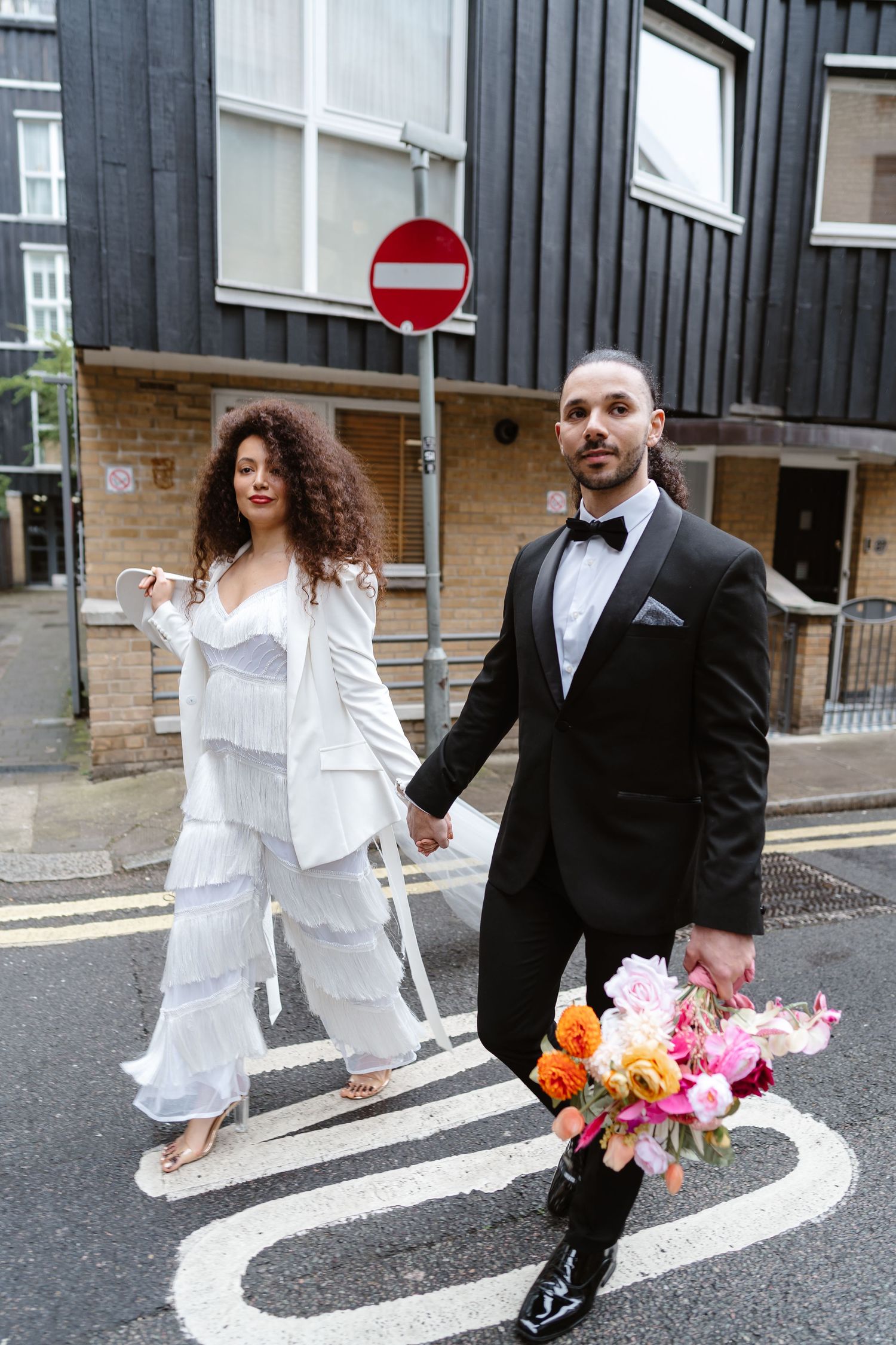 Relaxed wedding couple at The Hoxton, Holborn. London Wedding Photographer.  vibrant bouquet flowers