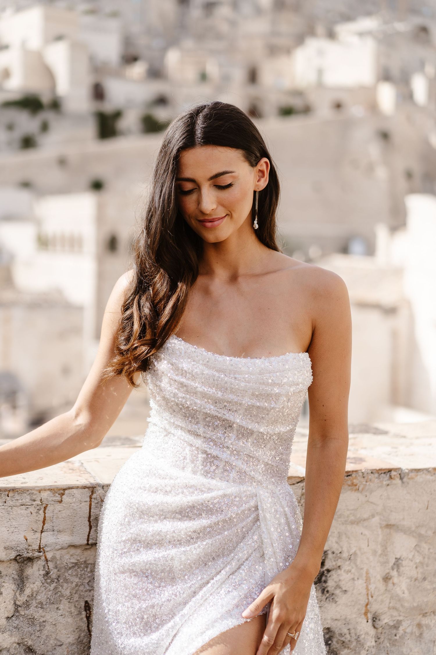 Subtle elegant carefree - simple hair and jewellery compliment the wedding dress