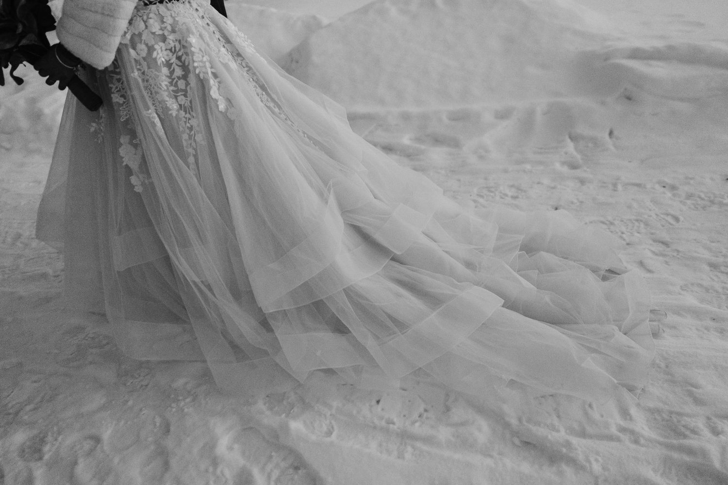Wedding dress in snow  at sunset. Luxury Lapland wedding photographer. Snow wedding. Lapland wedding photos. Log cabin lapland.