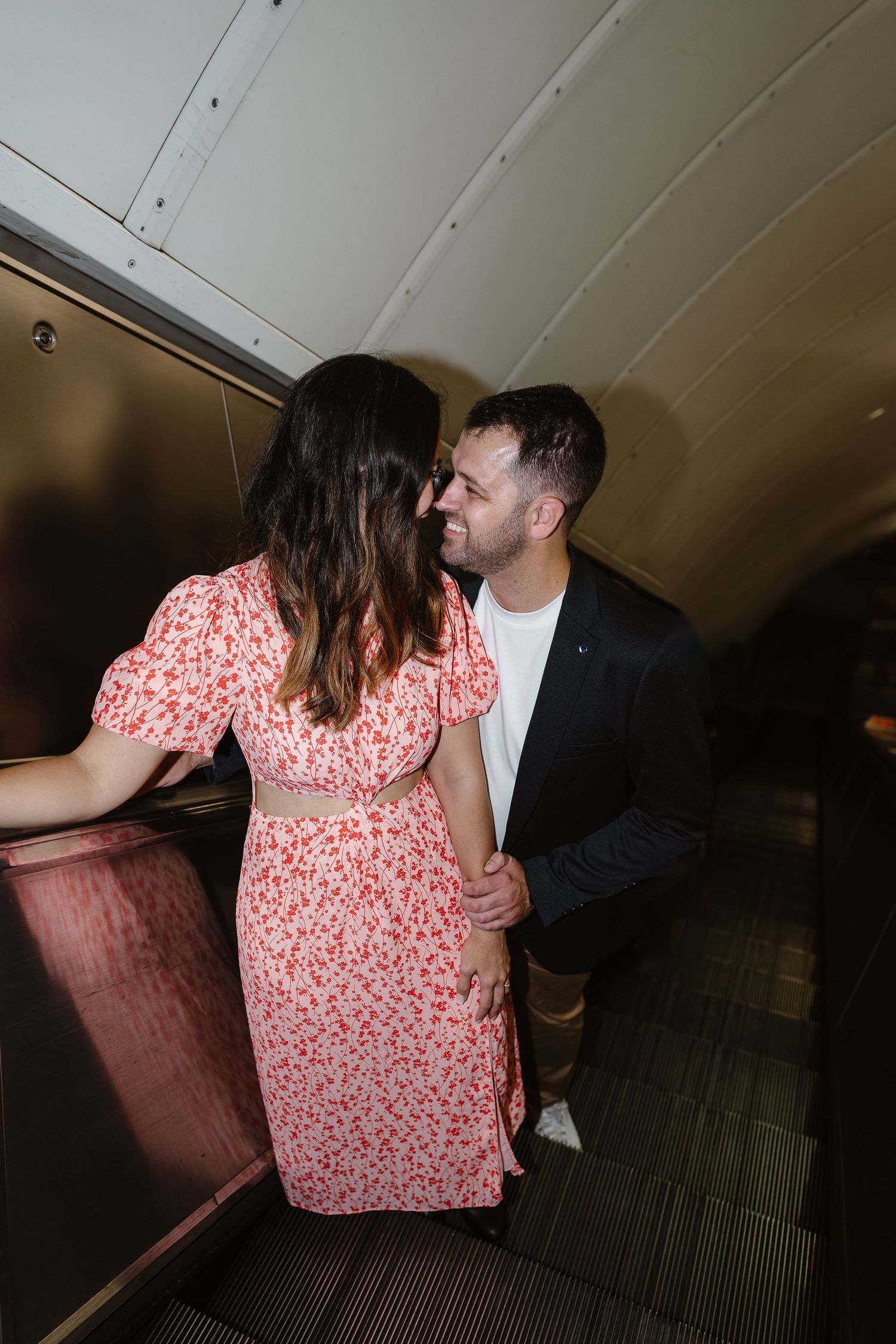 Alitha & James in Londons iconic london underground in Spring for their exciting Engagement / Pre-Wedding photoshoot engagement ring