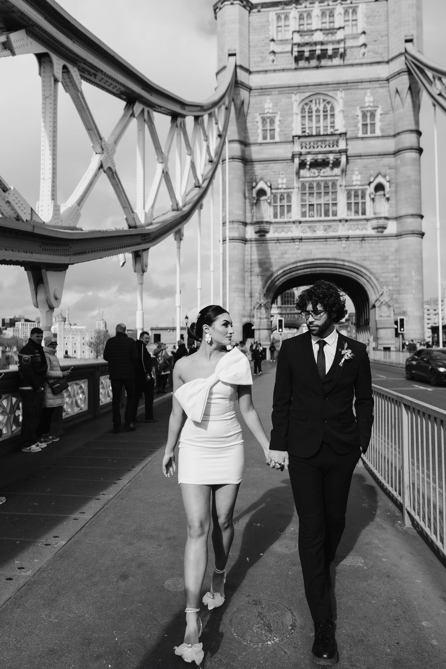 Luxury wedding photos at Tower Bridge. Bride short dress. documentary. Editorial. London Wedding Photographer. romantic