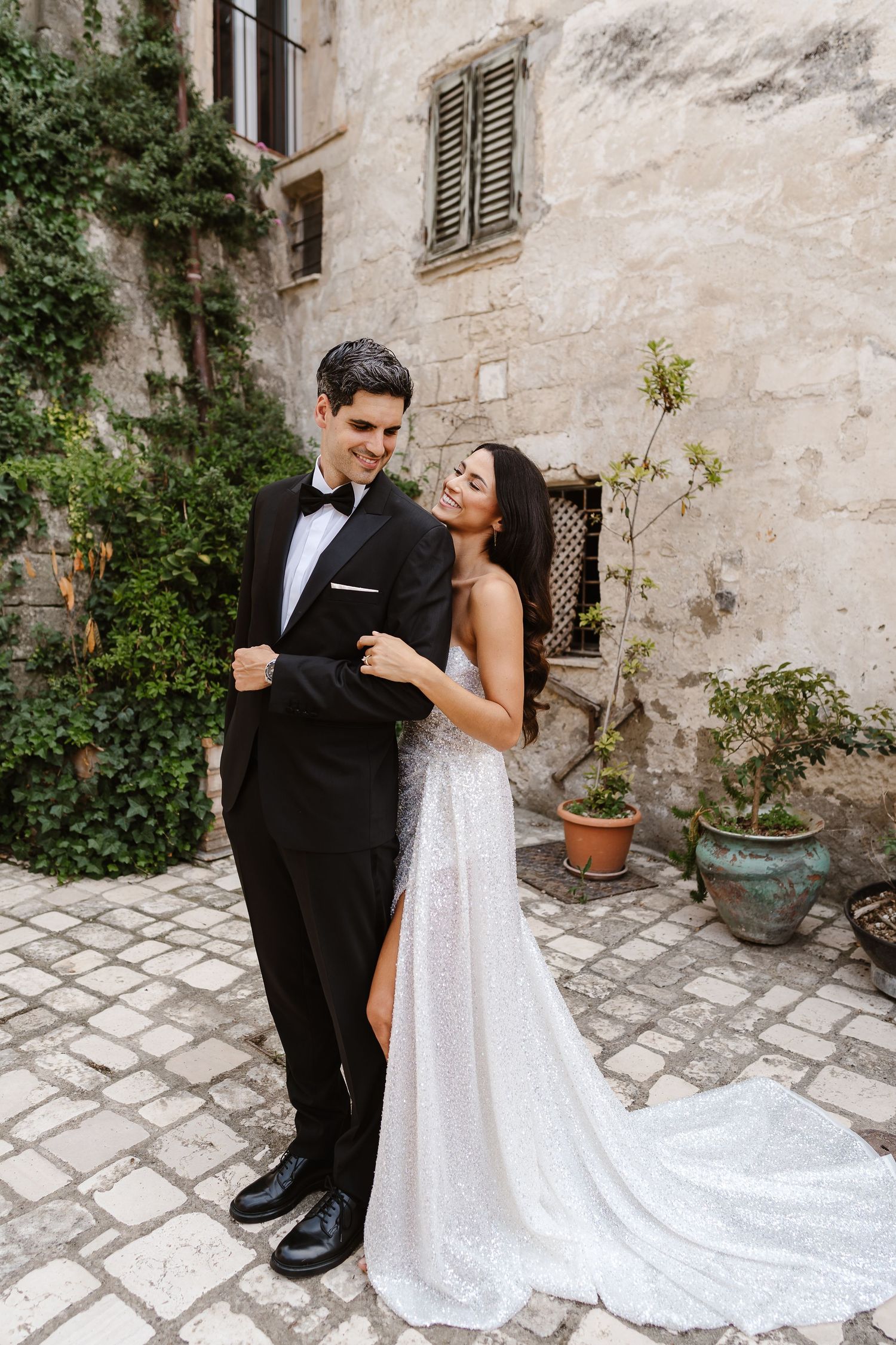 Cheeky over the shoulder smile - cobbled streets of matera old town