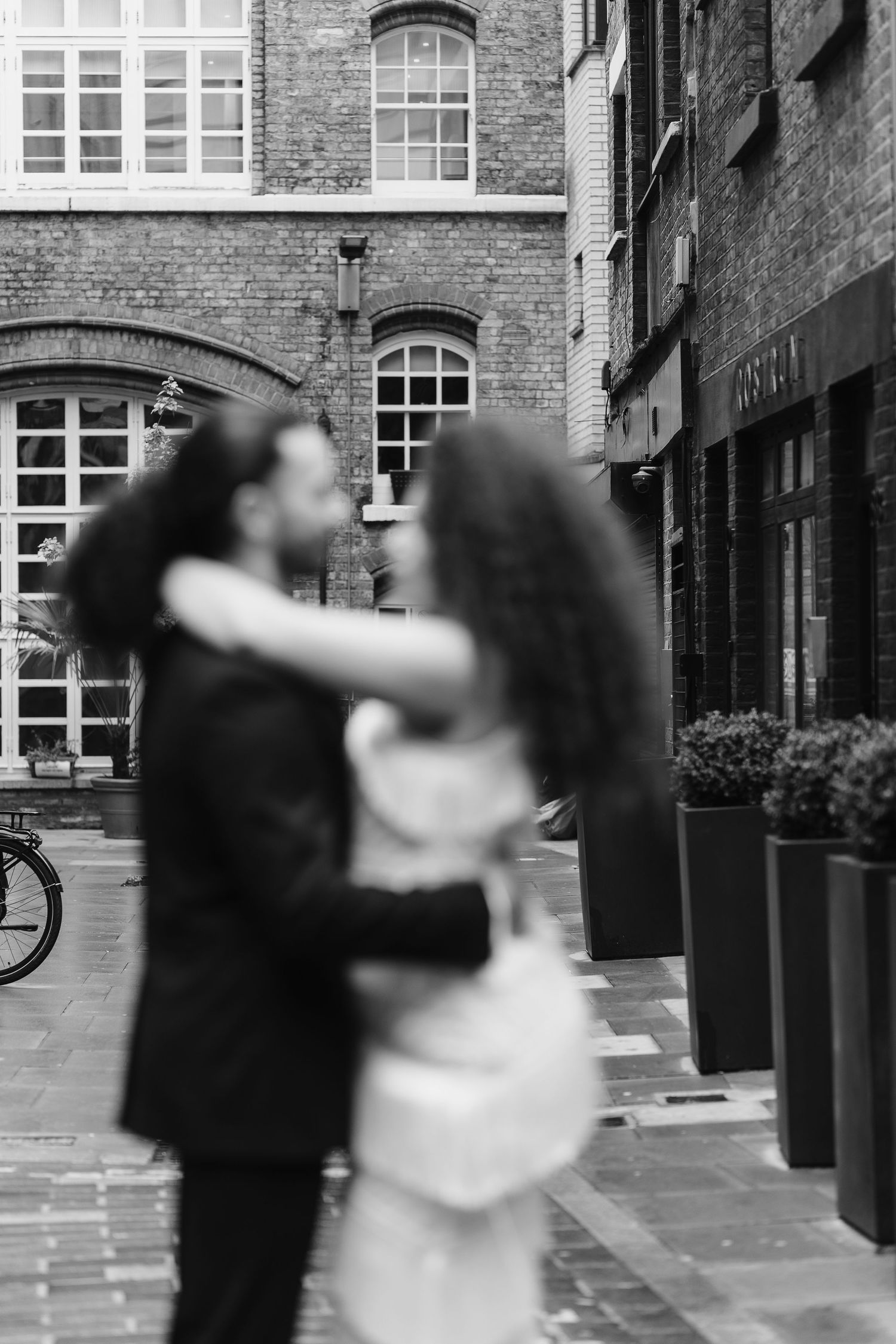 Relaxed wedding couple at The Hoxton, Holborn. London Wedding Photographer.  vibrant bouquet flowers