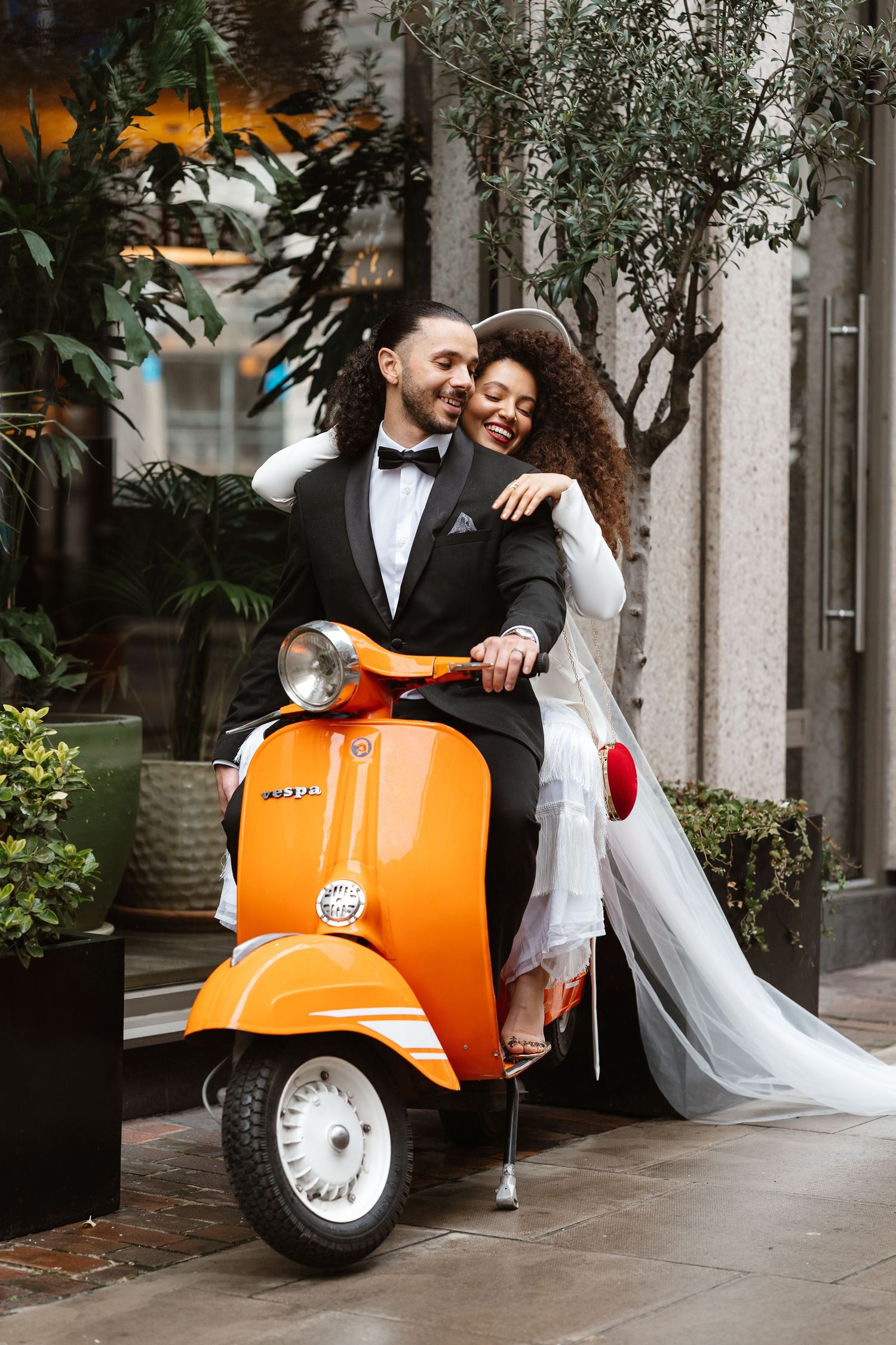 Relaxed wedding couple at The Hoxton, Holborn. London Wedding Photographer.  vespa