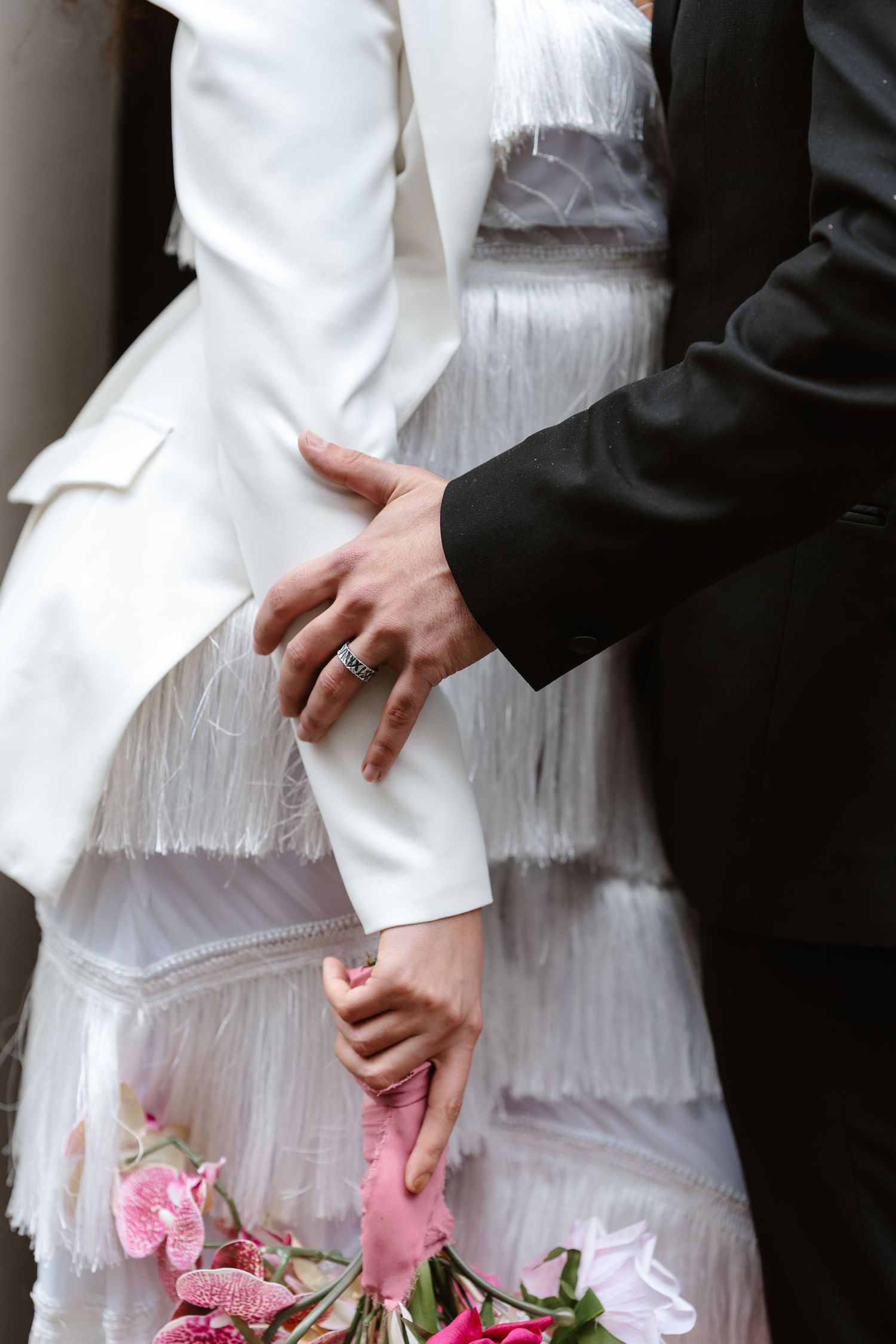 Relaxed wedding couple at The Hoxton, Holborn. London Wedding Photographer.  vibrant bouquet flowers