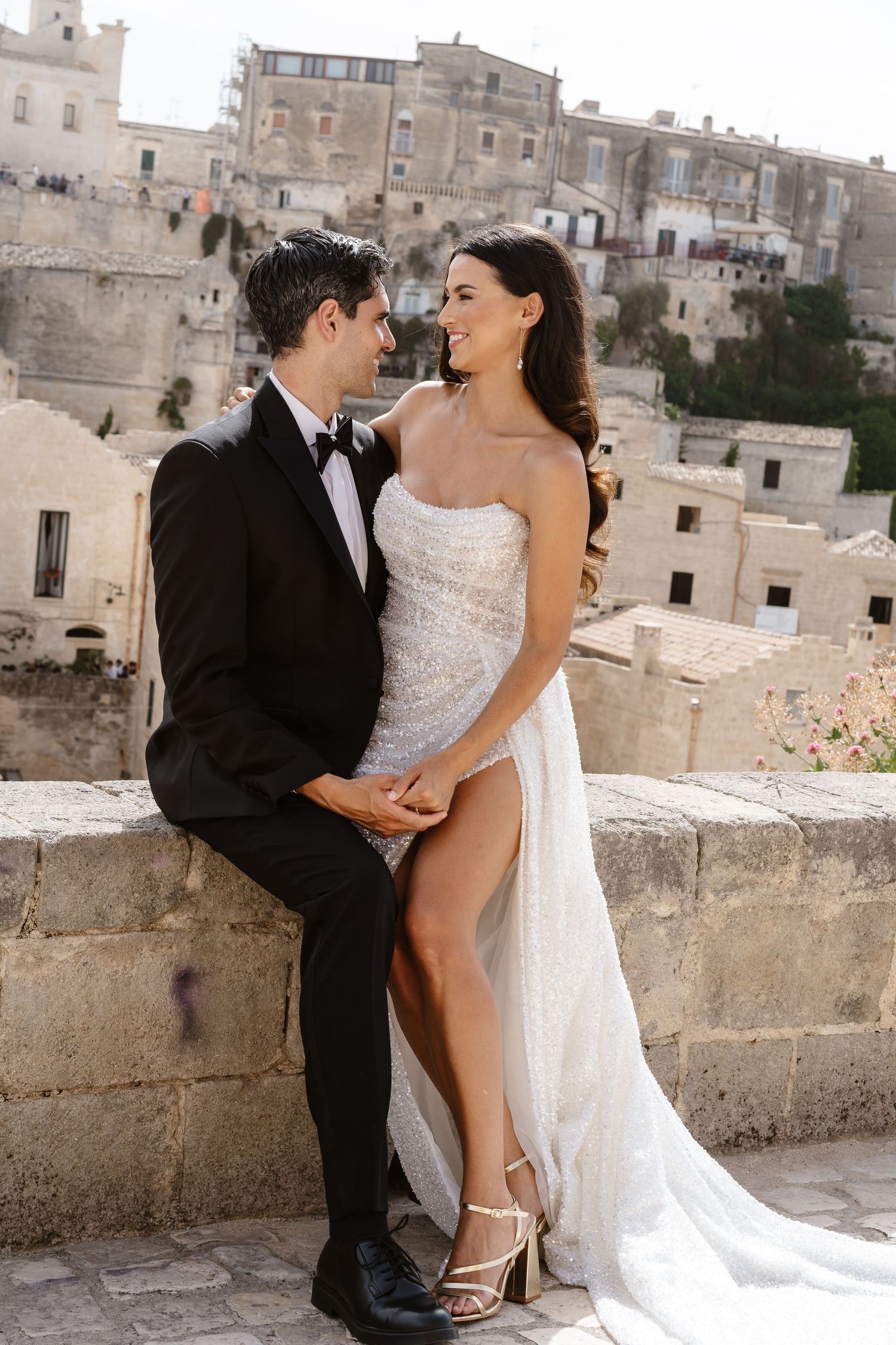 Embracing the full side split on the exquisite sequined Wedding dress. flirty vibe