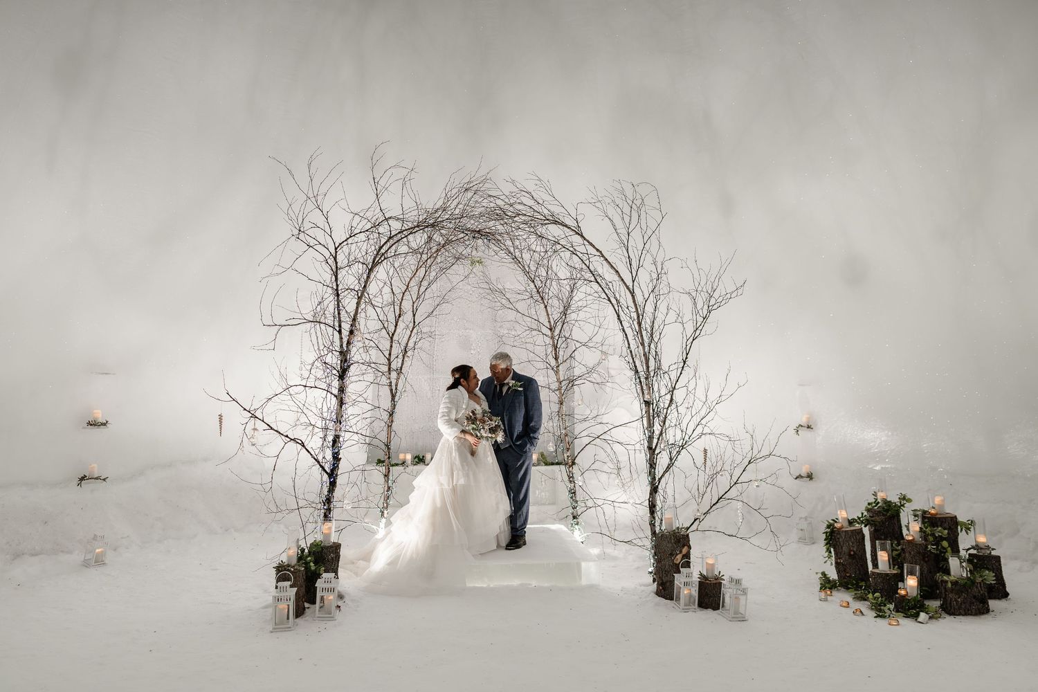 First kiss during ceremony-luxury wedding at Snow Chapel, Northern Lights Village, Levi. Lapland Wedding Photographer. Love in Lapland