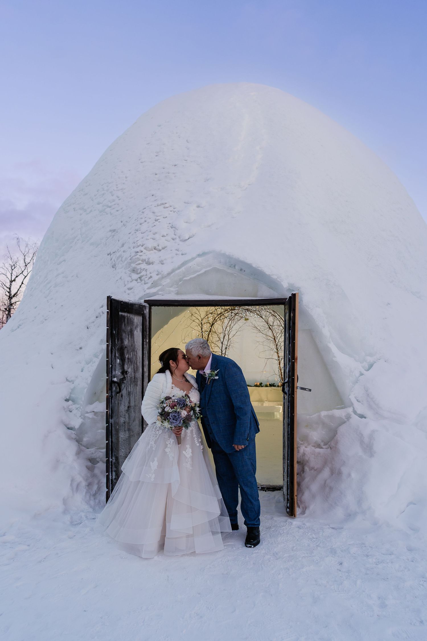 Pink skies and twilight for luxury wedding at Snow Chapel, Northern Lights Village, Levi. Lapland Wedding Photographer. Love in Lapland