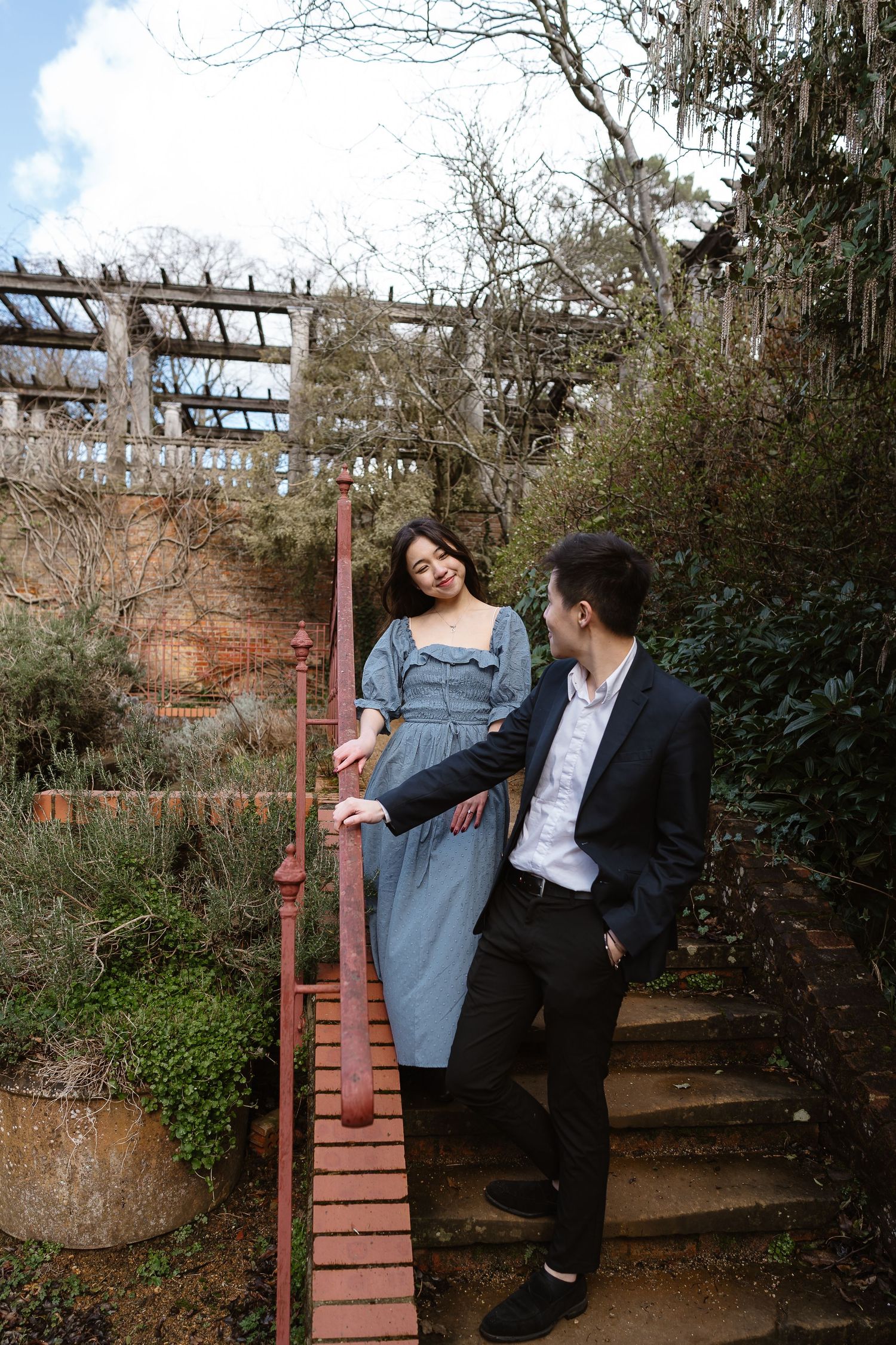 Laidback couple, casual blue flowing dress, casual trousers and jacket, London photographer