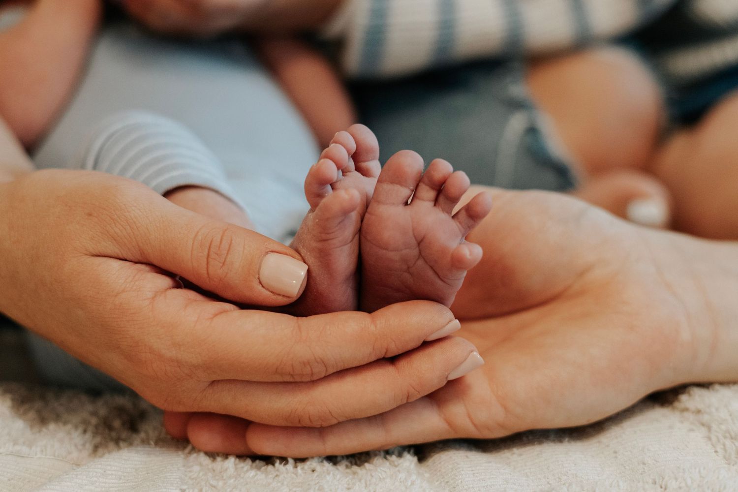 Series of gentle hands touching and holding on white fabric background.