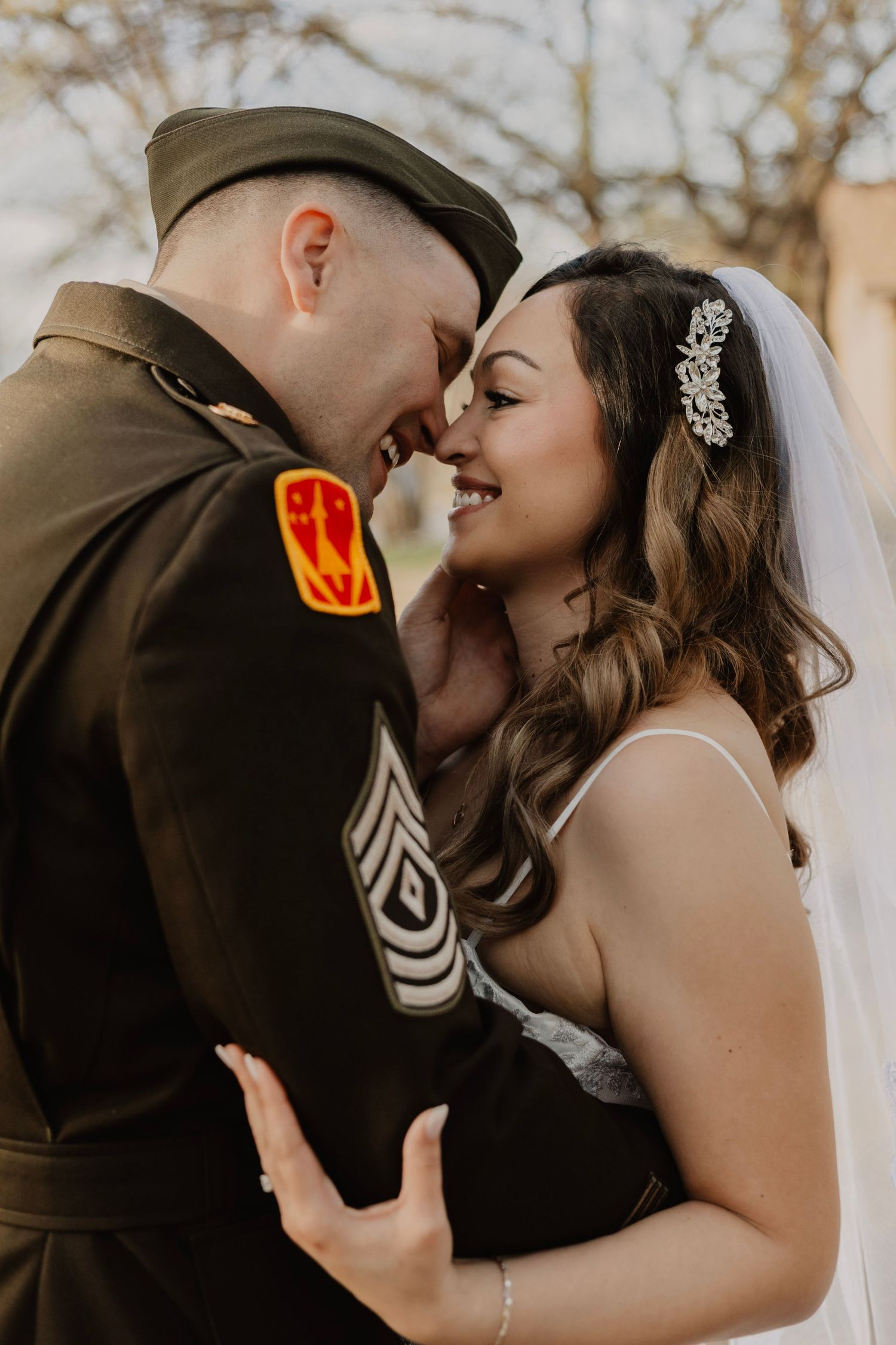Close-up shots of newlyweds sharing romantic moments in military wedding attire.