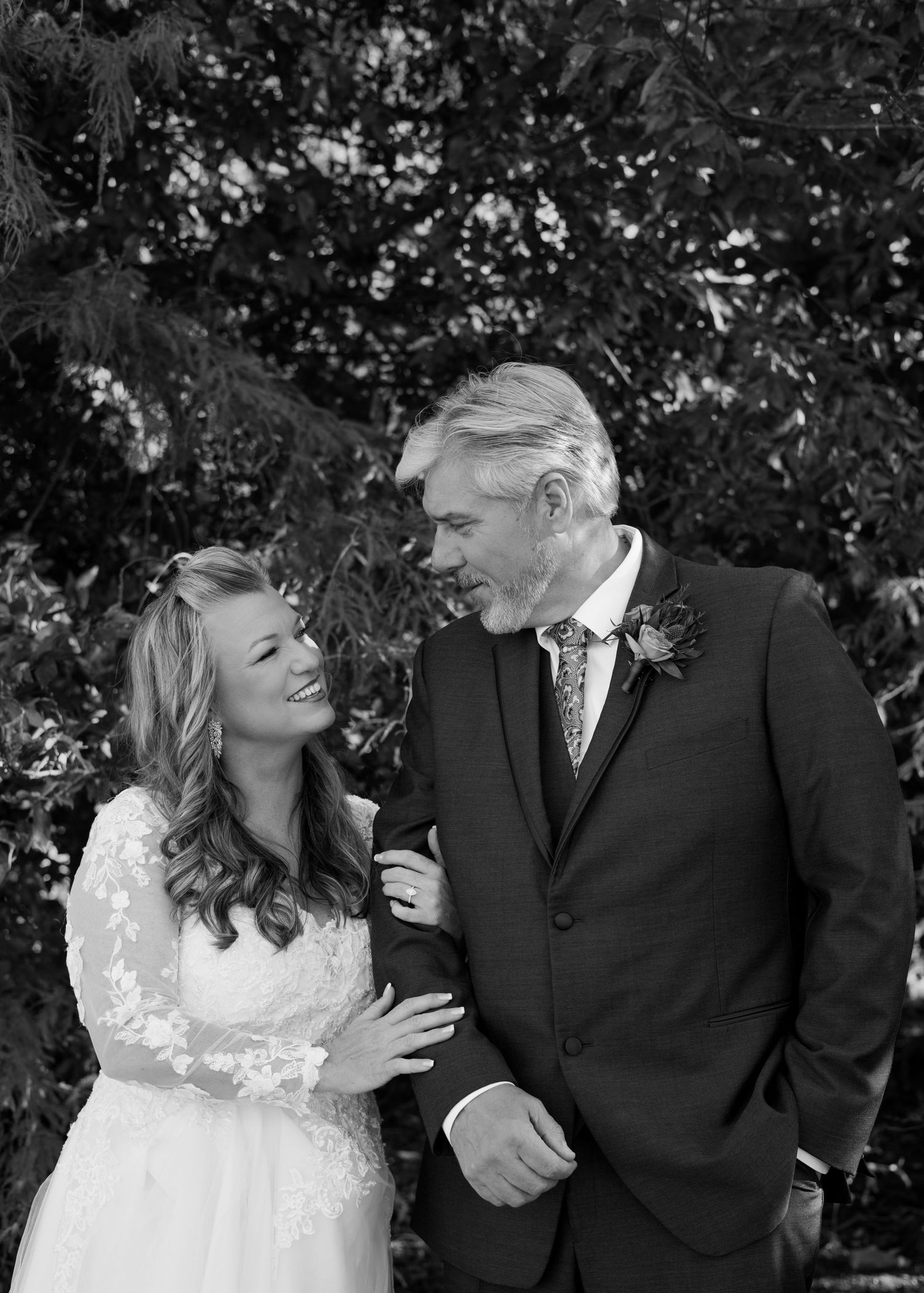 Black and white photo series of a couple sharing intimate moments during their wedding photoshoot.