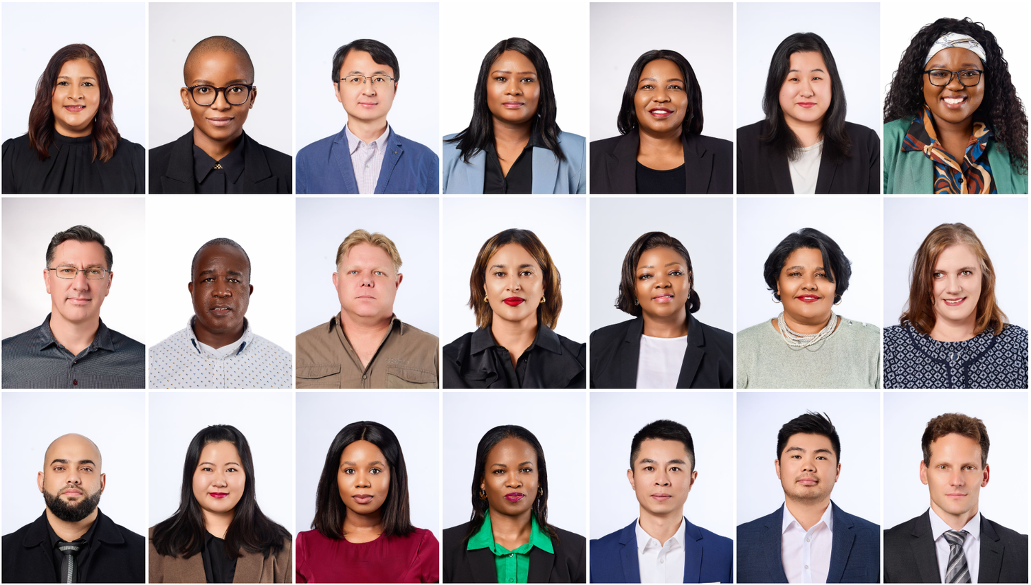 A diverse group of 19 professional headshots featuring men and women of various ethnicities in business attire on a white background.