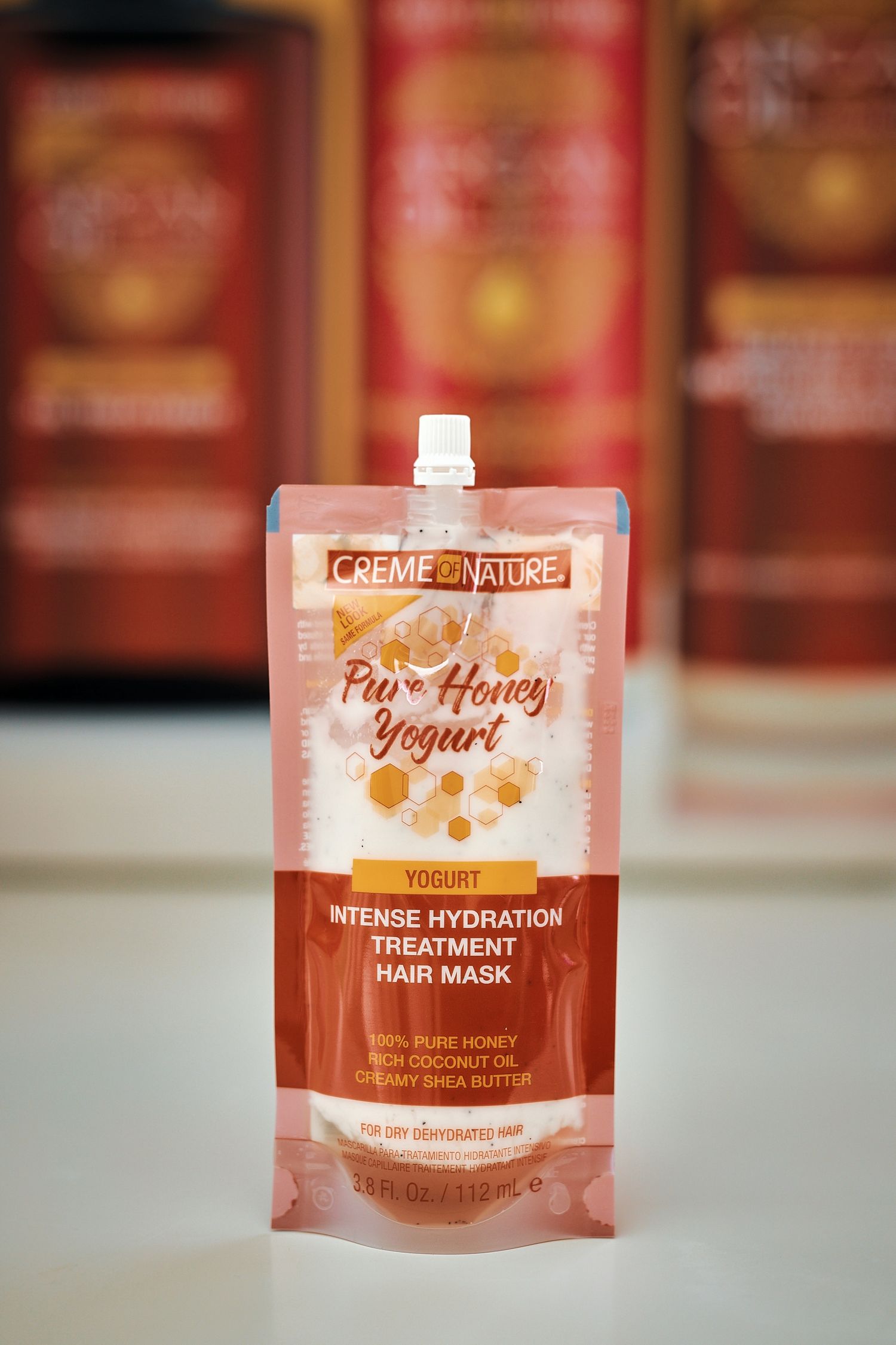 Creme of Nature Pure Honey Yogurt Intense Hydration Treatment Hair Mask pouch product.