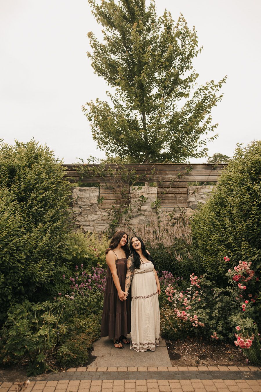 Candid family photos inside the walled garden at the historic barns park botanical gardens in traverse city michigan