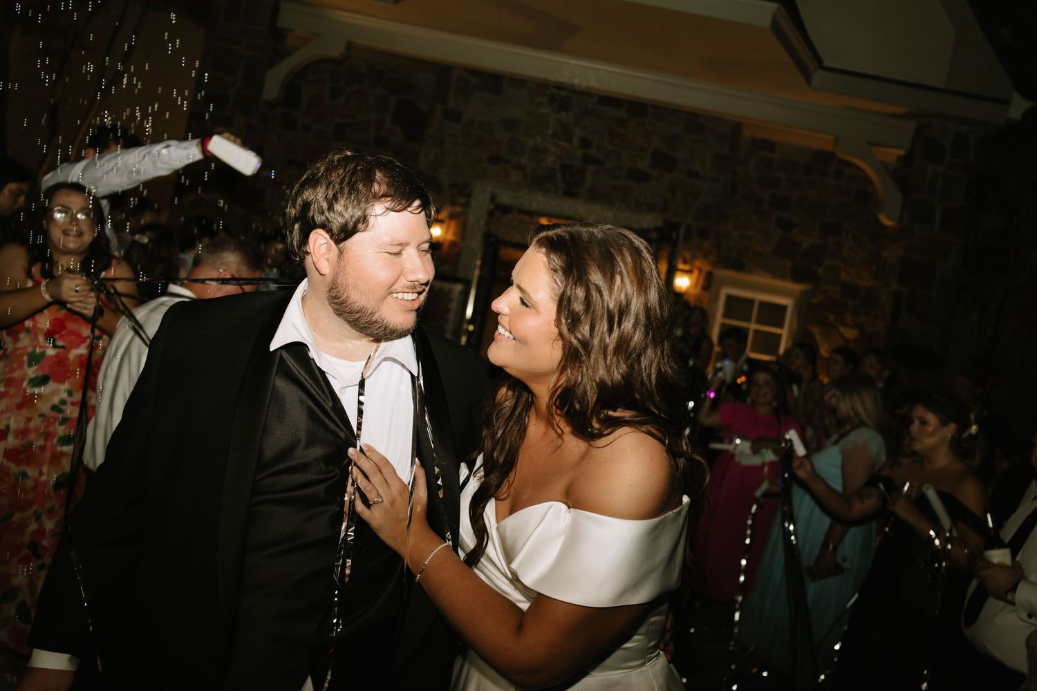 Bride and groom sharing a romantic dance together at their wedding reception celebration.