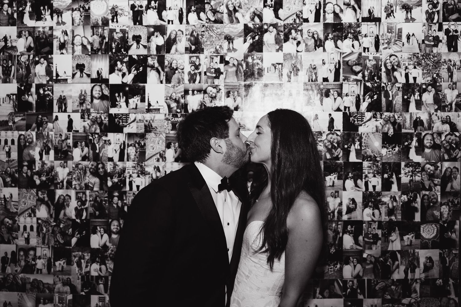 Black and white photo collage of wedding moments displayed on a wall.