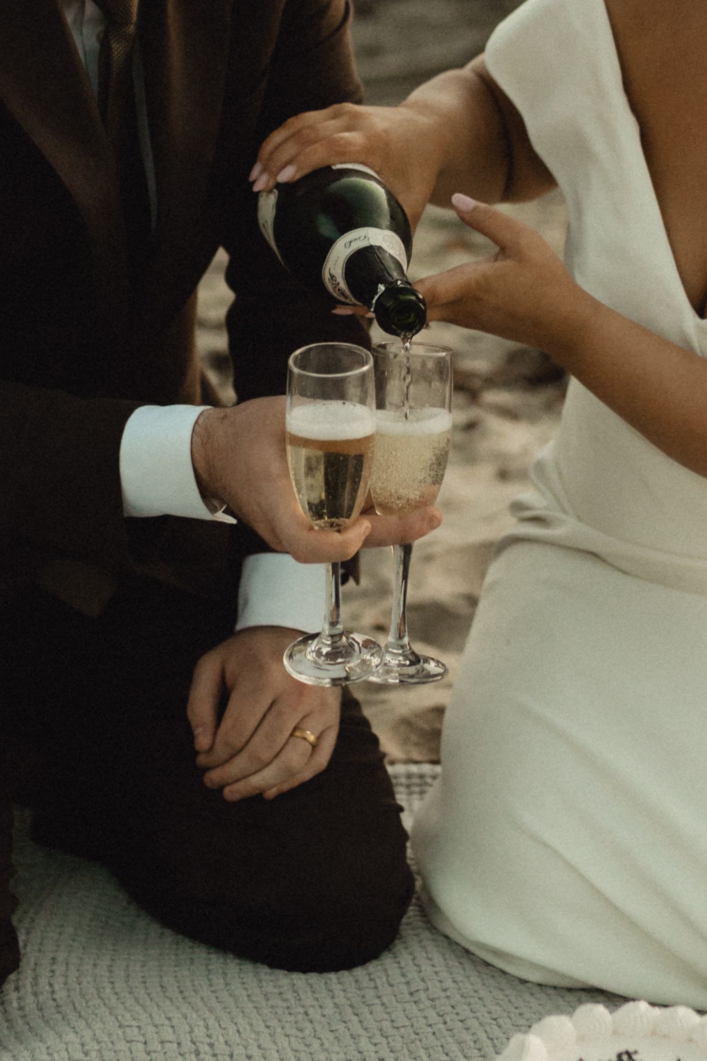 Champagne being poured into glasses during an intimate celebration.