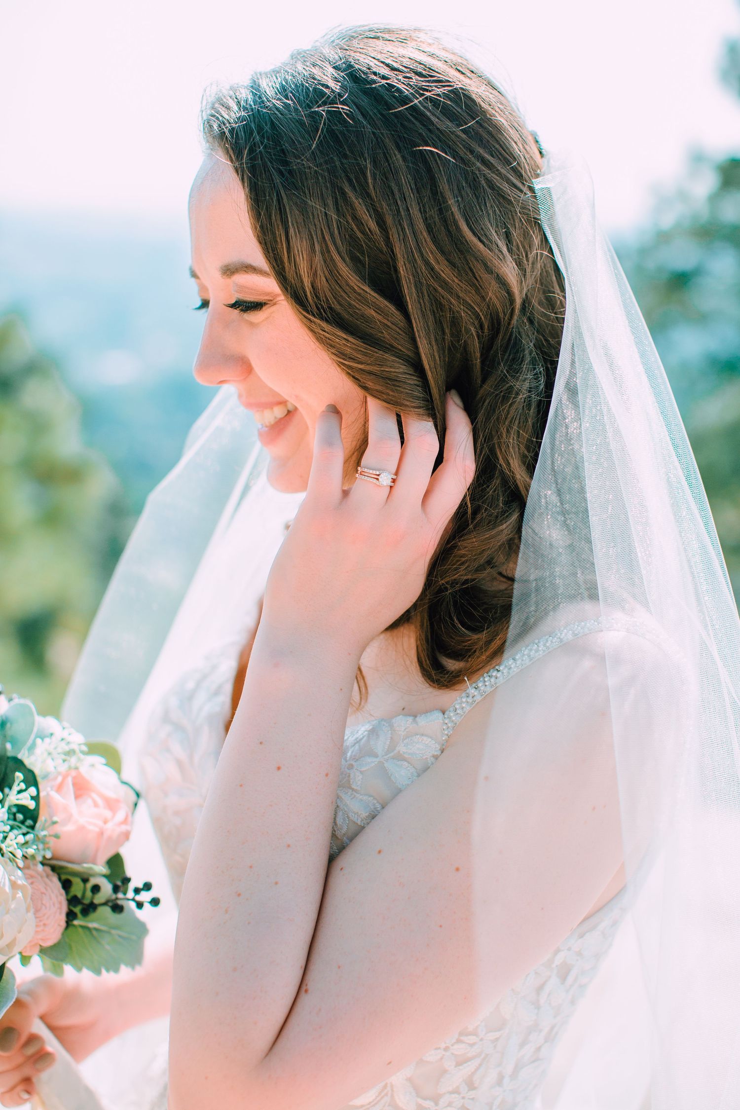 A bride in a white veil poses outdoors in a dreamy sequence of four romantic bridal portraits.