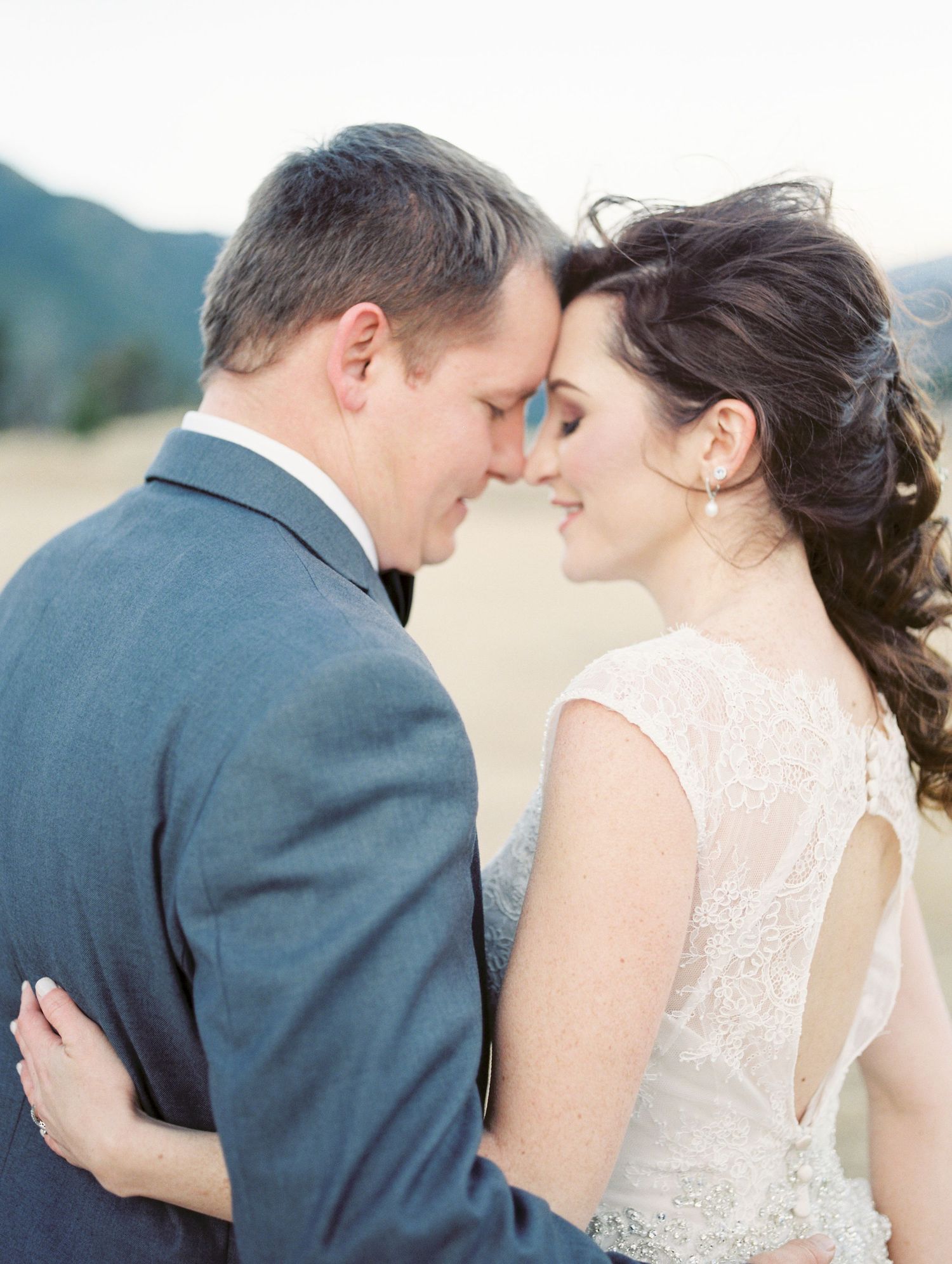 Romantic couple in wedding attire sharing intimate moments in a series of close-up shots.