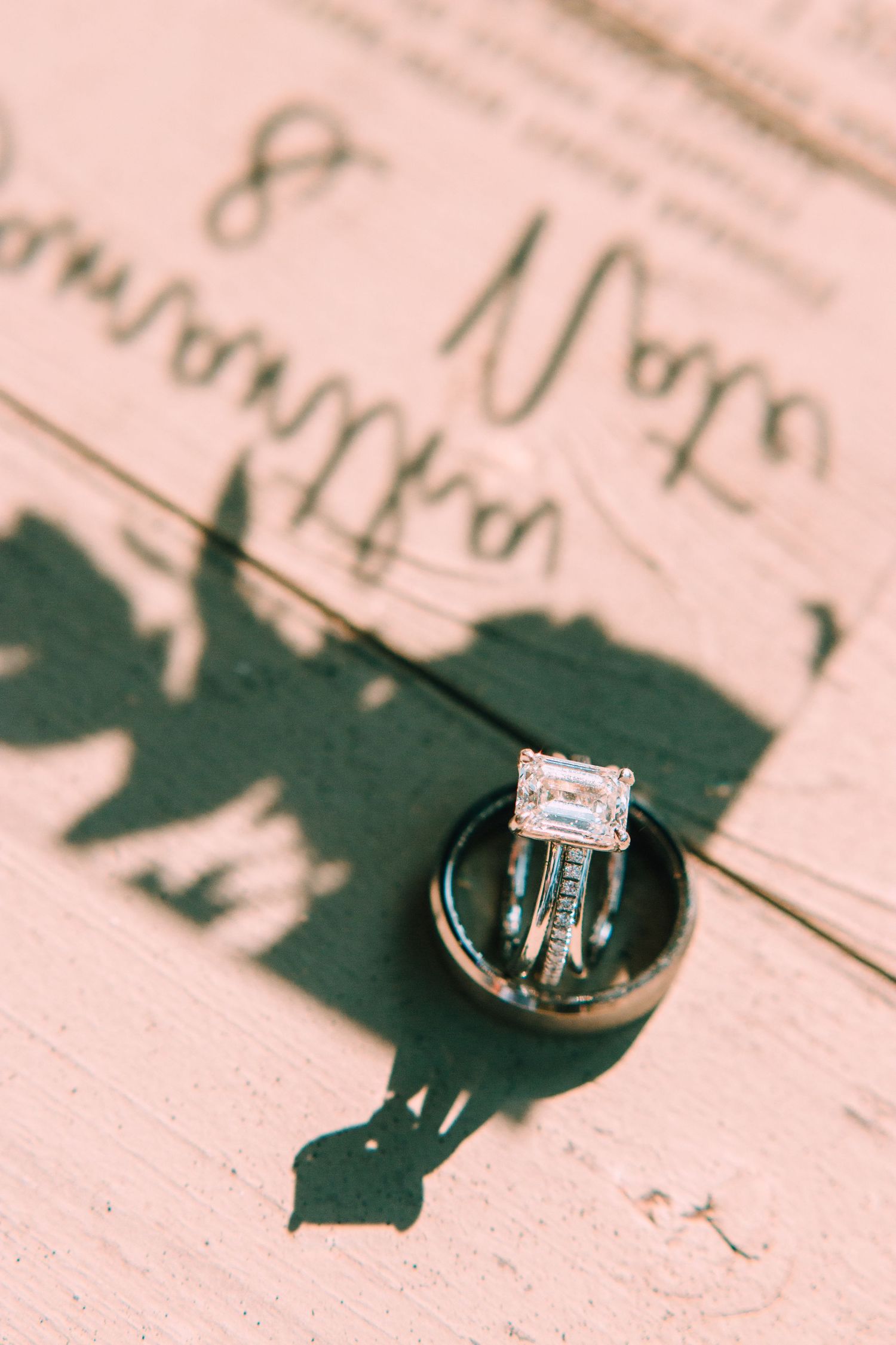 A close-up sequence of a diamond engagement ring casting shadows on sheet music paper creates an artistic composition.