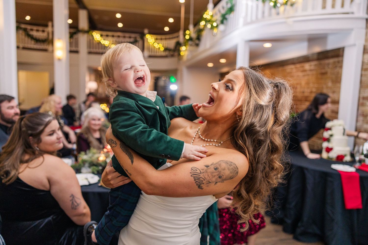 Candid moment of celebration and laughter during wedding reception festivities wedding groom bride wilmington North Carolina photographer