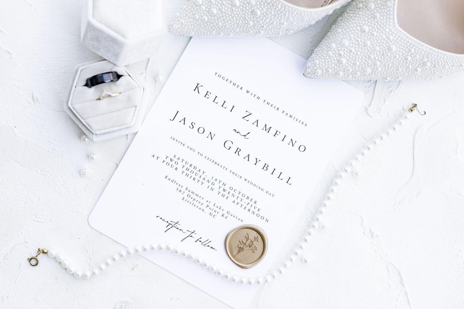 Classic white wedding invitations with wax seals and delicate typography wedding groom bride lake Gaston photographer light airy