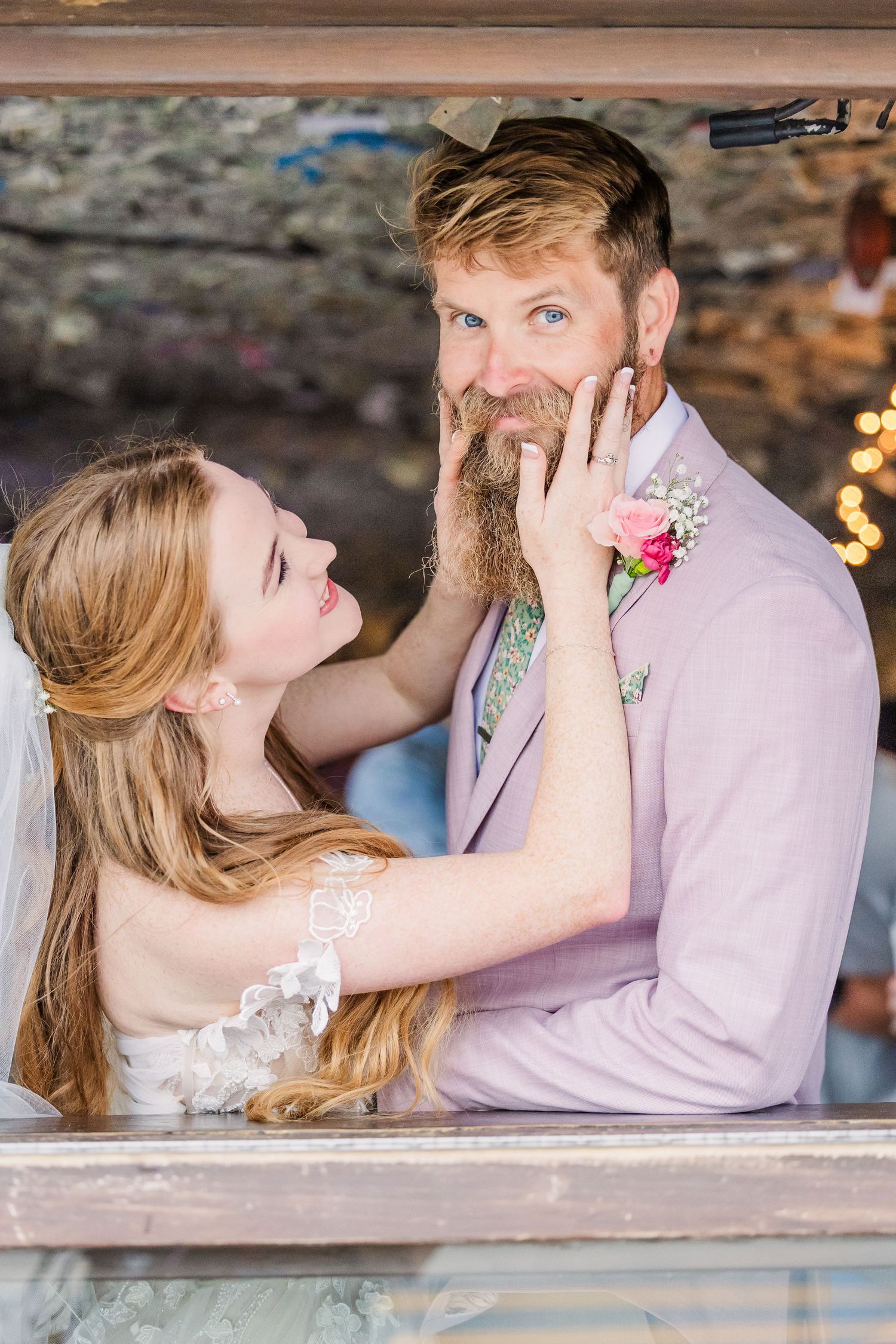 Wrightsville Beach bride and groom in jimmys dive bar embracing in a sweet moment