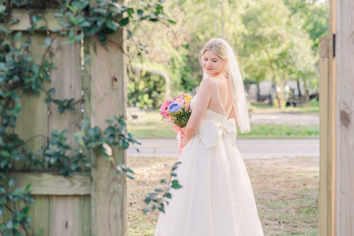 A flowing white wedding garden setting wedding groom bride wilmington photographer light and airy classic Wrightsville Beach