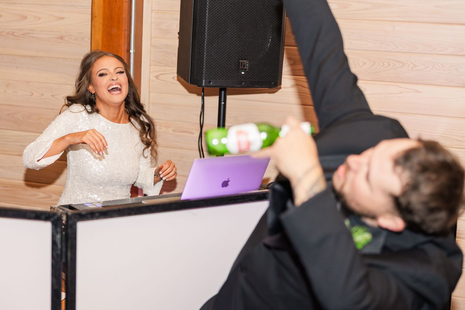 Wedding reception entertainment setup with DJ equipment and dancing wedding groom bride wilmington North Carolina photographer light airy