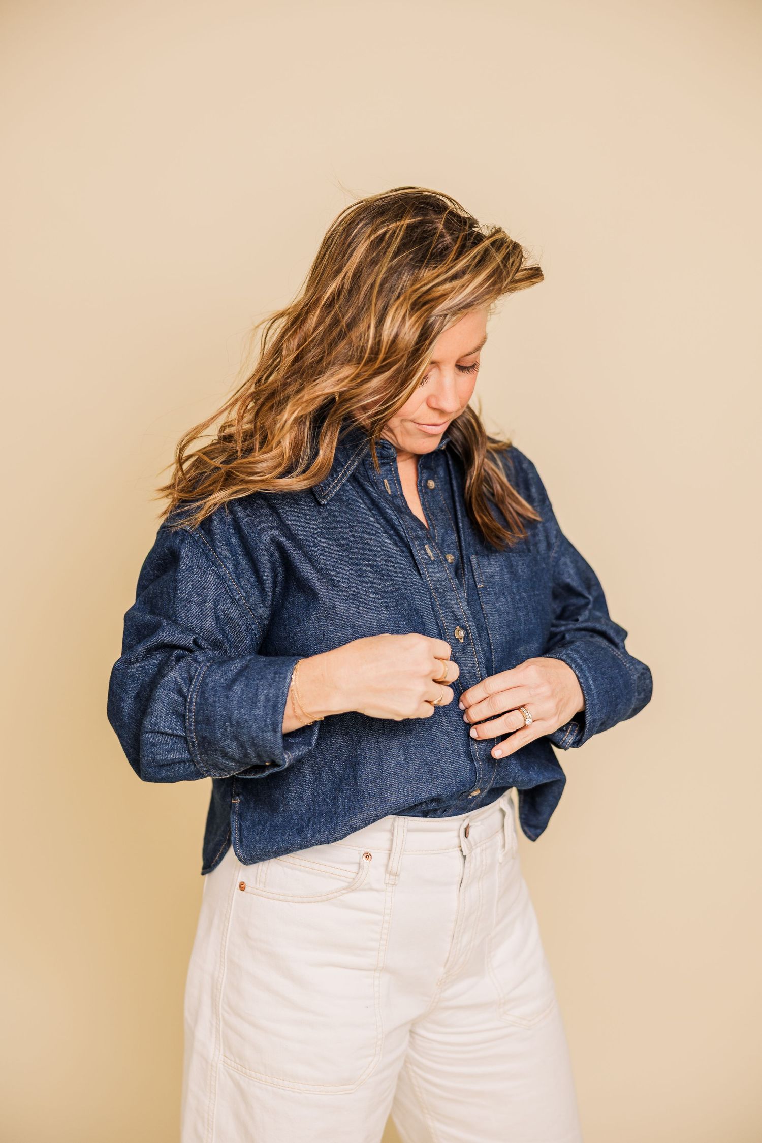 Dynamic fashion poses showing movement in denim and white outfit combination.